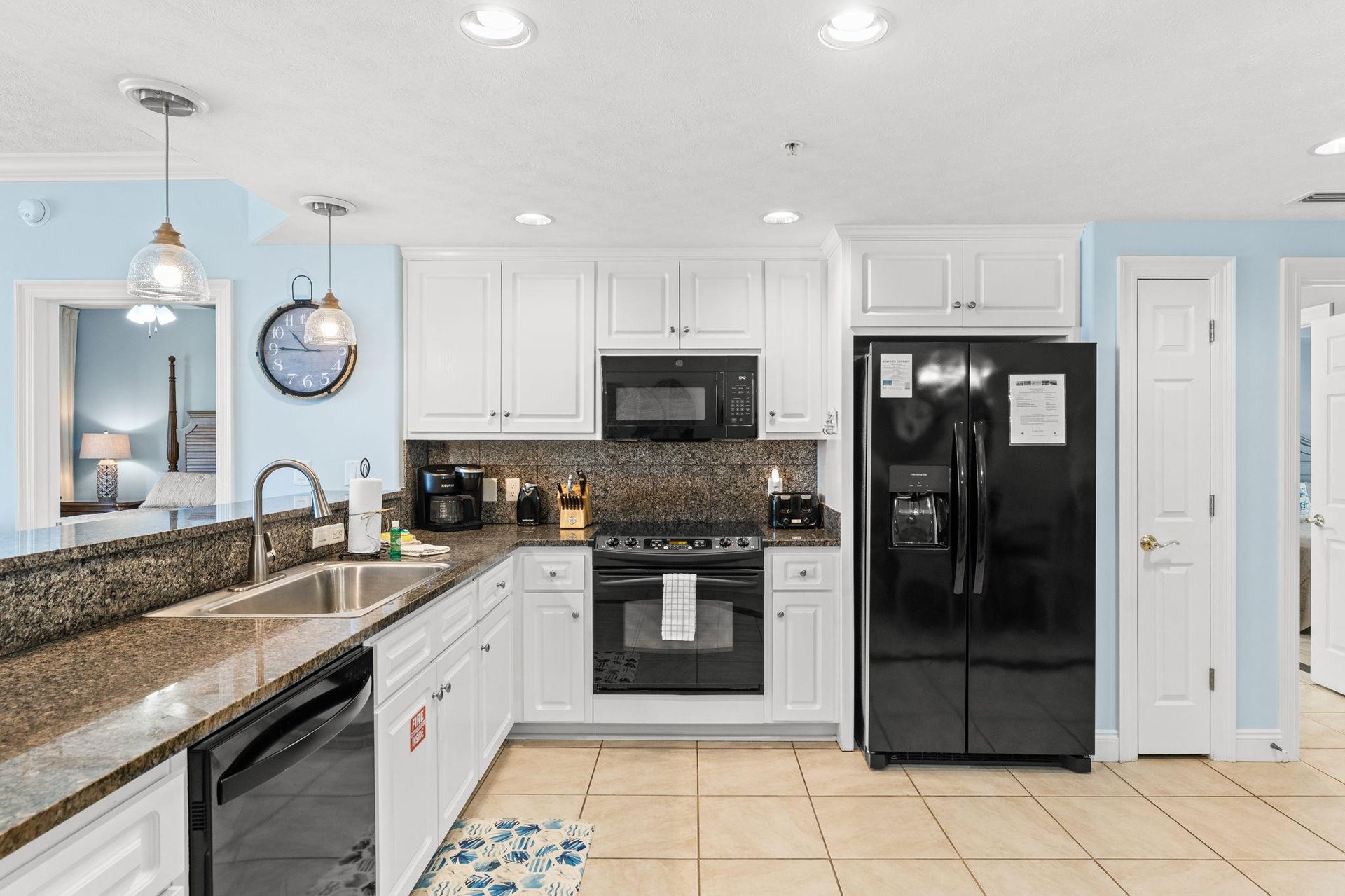 The fully equipped kitchen features granite countertops and has everything you need to prepare meals for family  friends.