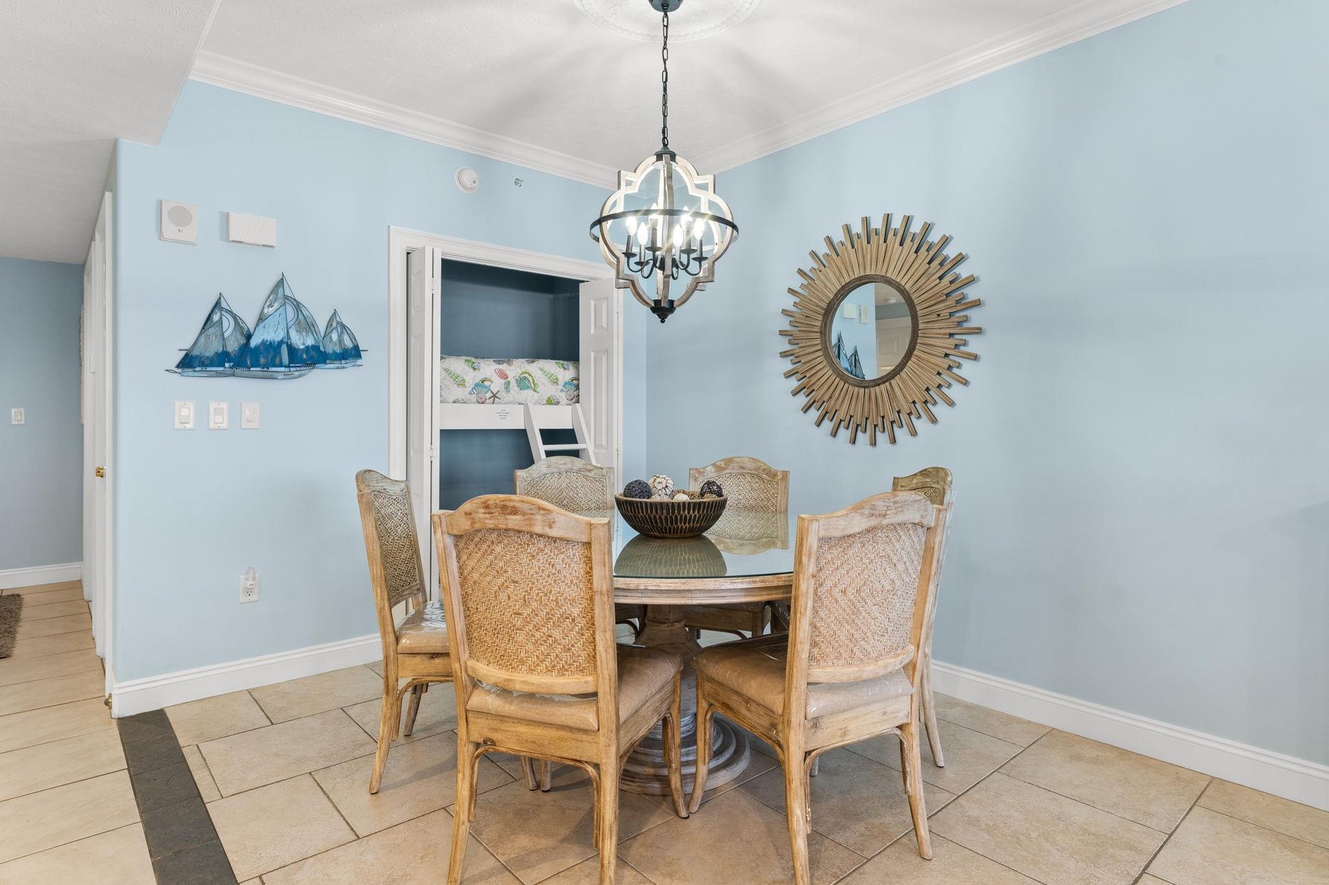 There is a dining table, perfect for enjoying a meal or playing a game, as well as additional breakfast bar seating.