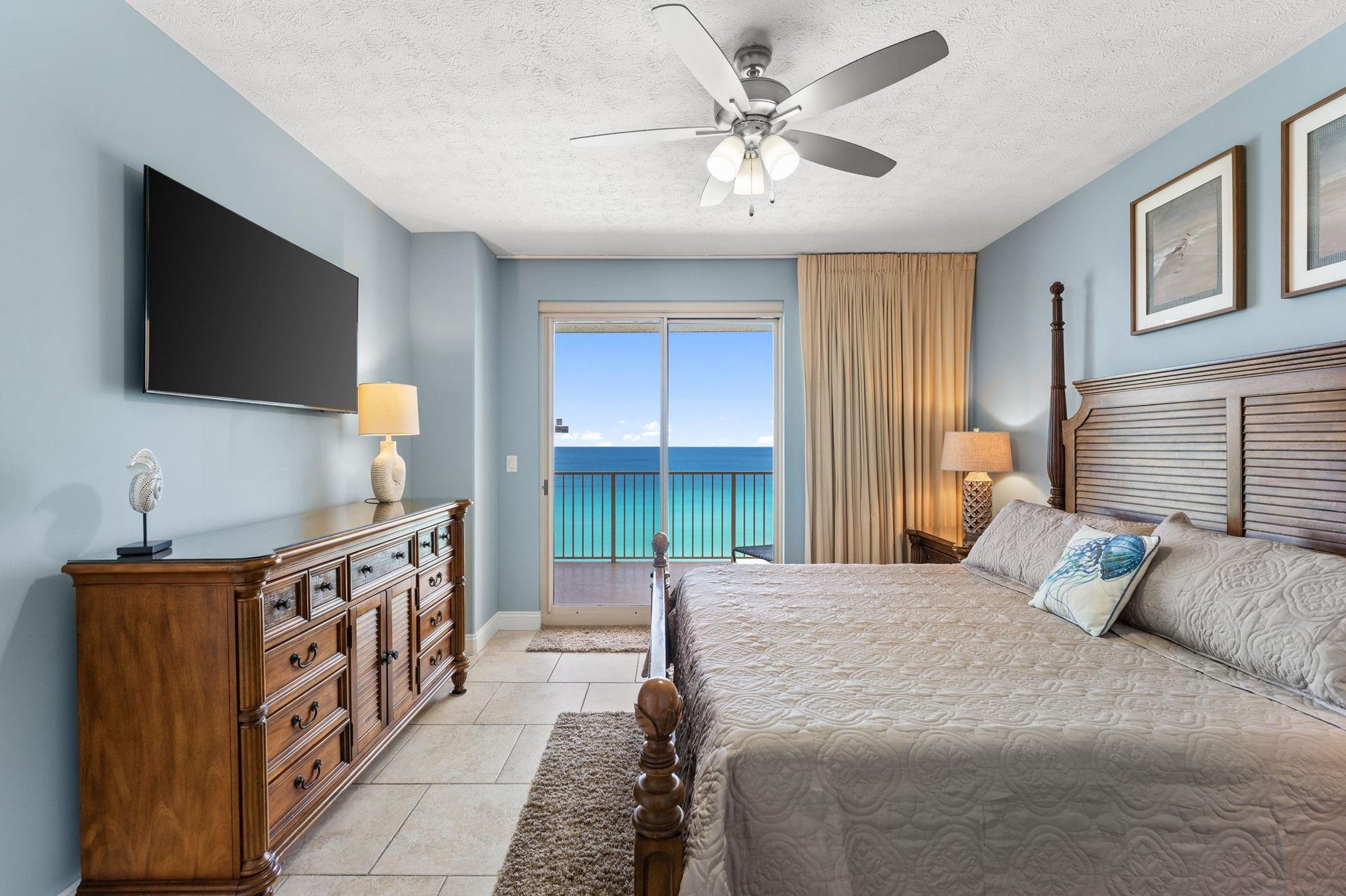 The gulf front master bedroom offers a Kingsized bed, a television, access to the balcony, and it own ensuite bathroom.