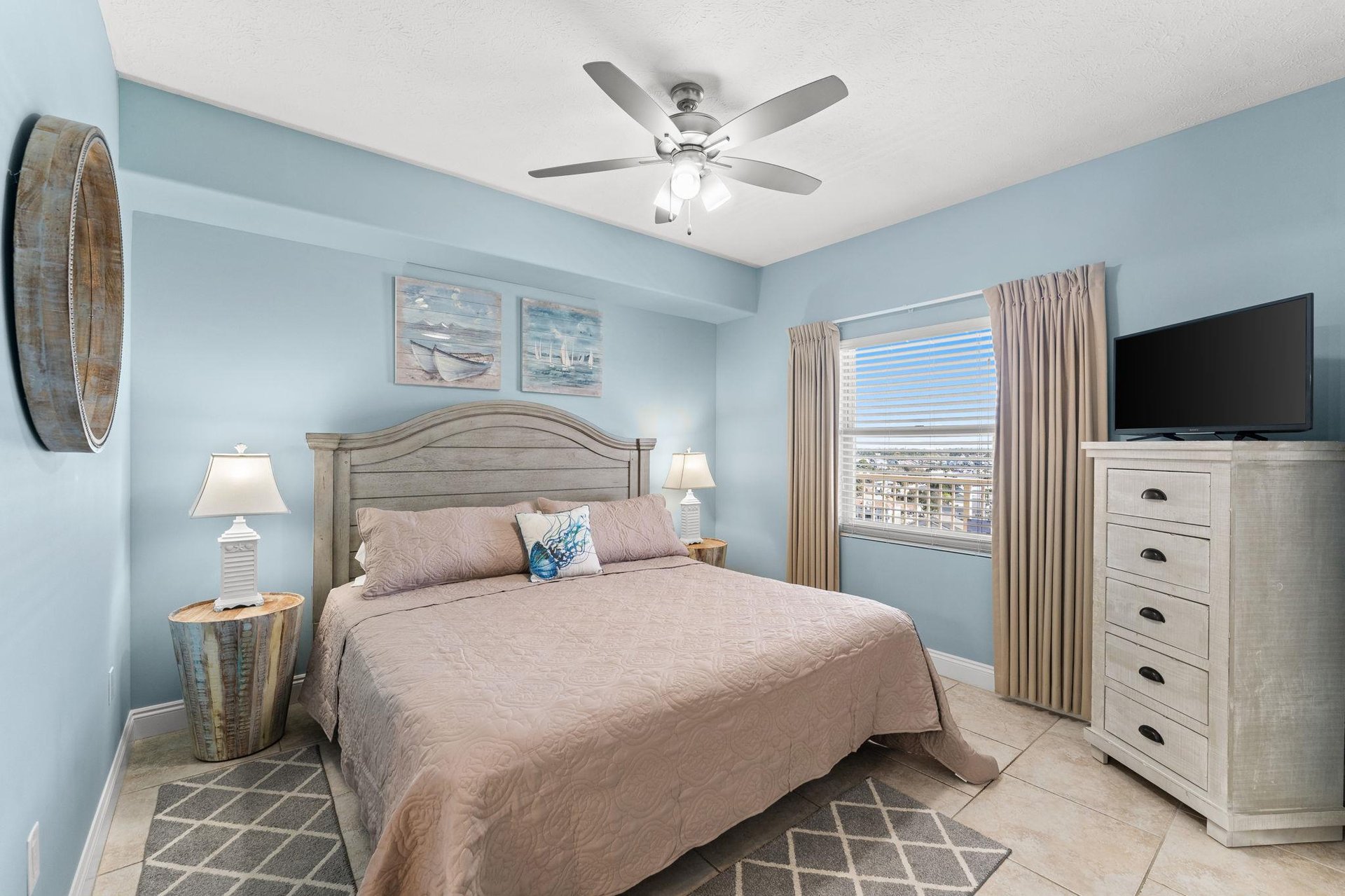 The front bedroom offers another Kingsized bed, a television, and direct access to the second bathroom.