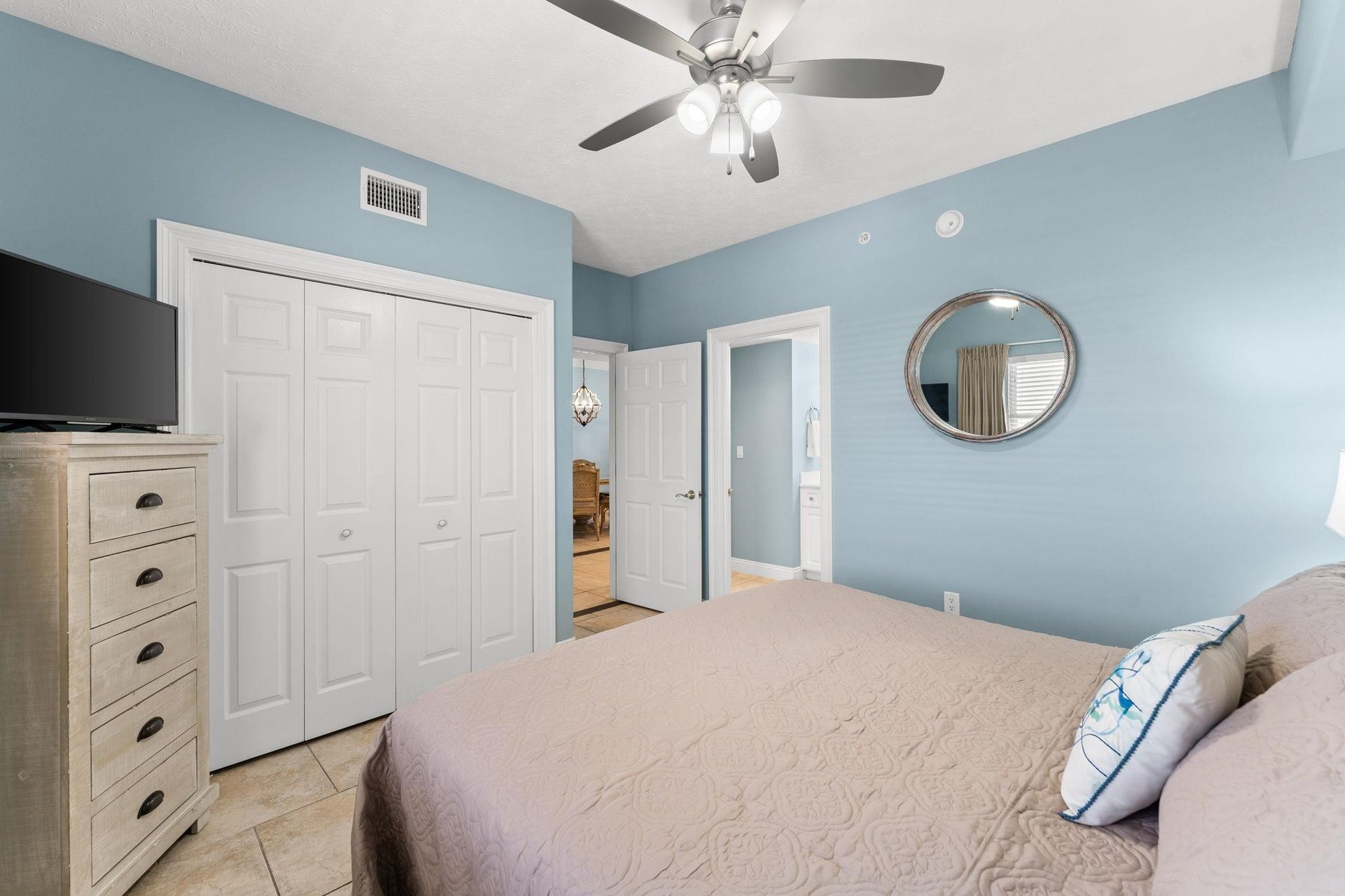 The front bedroom offers another Kingsized bed, a television, and direct access to the second bathroom.