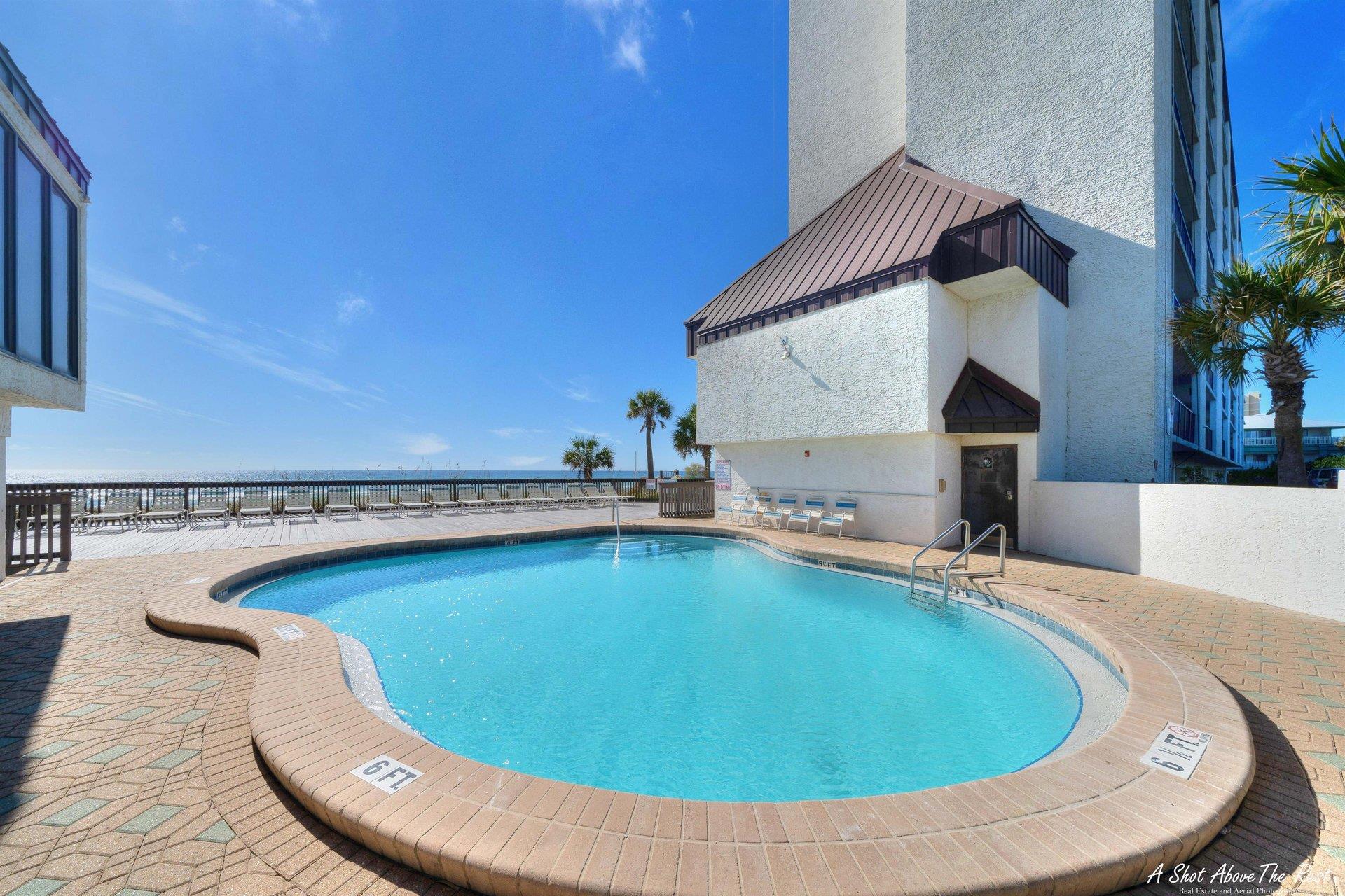 Sparkling gulffront swimming pool at Seachase condos in Panama City Beach, FL