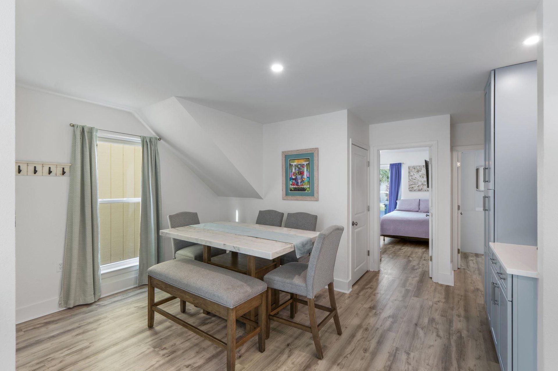 Gather around your spacious dining table for memorable meals with loved ones in this bright, airy space.
