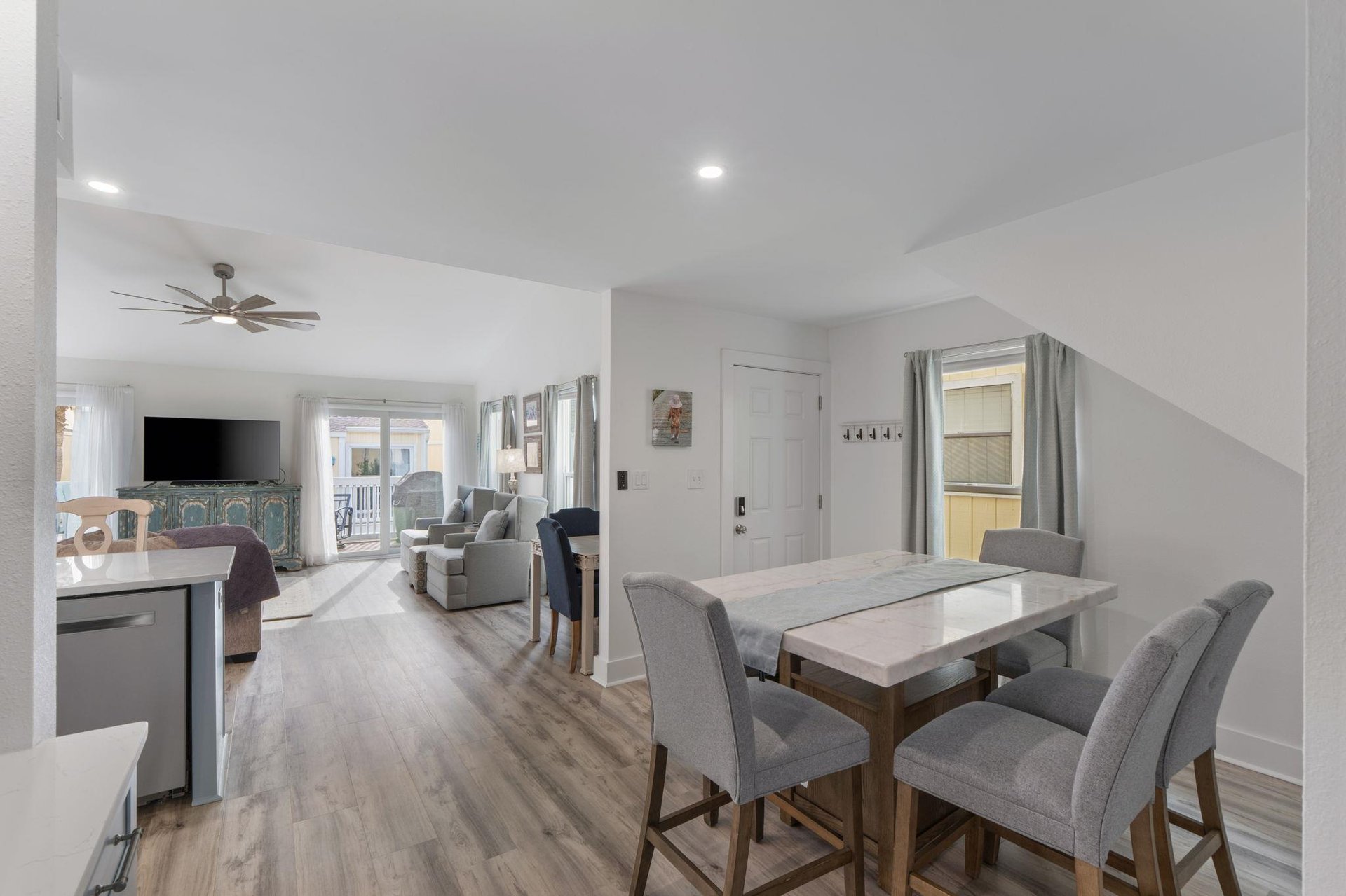 Relax in your bright, openplan living space with modern dining and comfortable seating areas flowing seamlessly together.