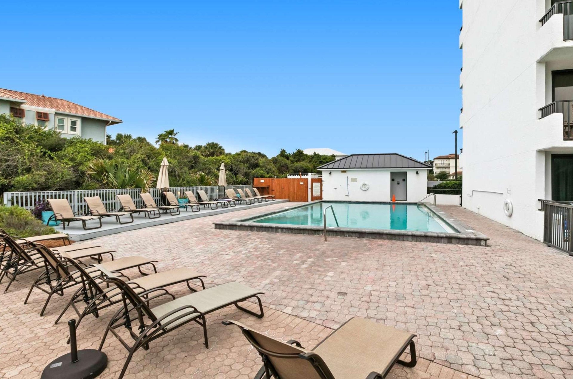 The outdoor swimming pool and pool deck at One Seagrove Place on Highway 30A in Florida