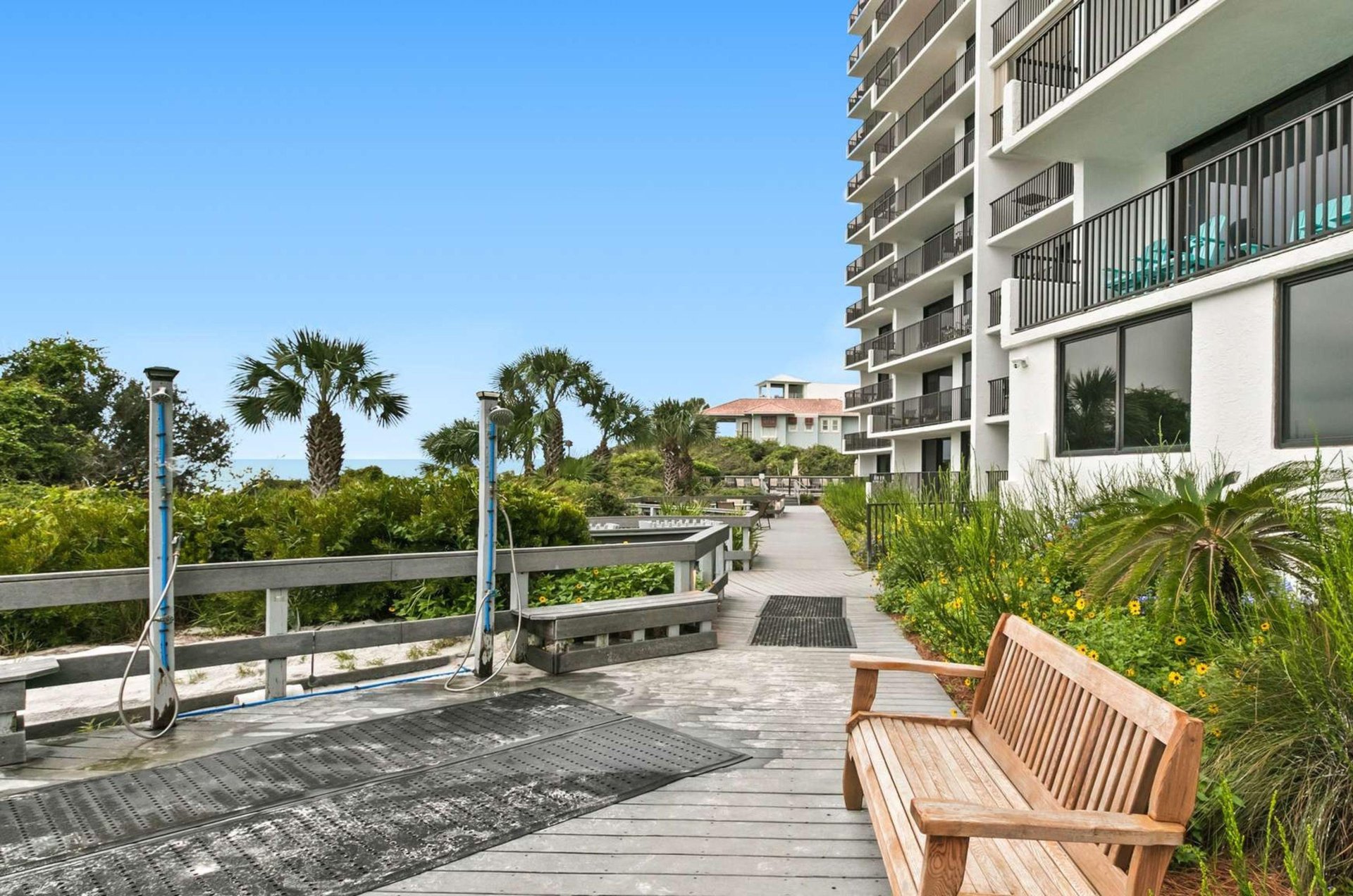 The outdoor showers on the boardwalk at One Seagrove Place in Seagrove Beach Florida