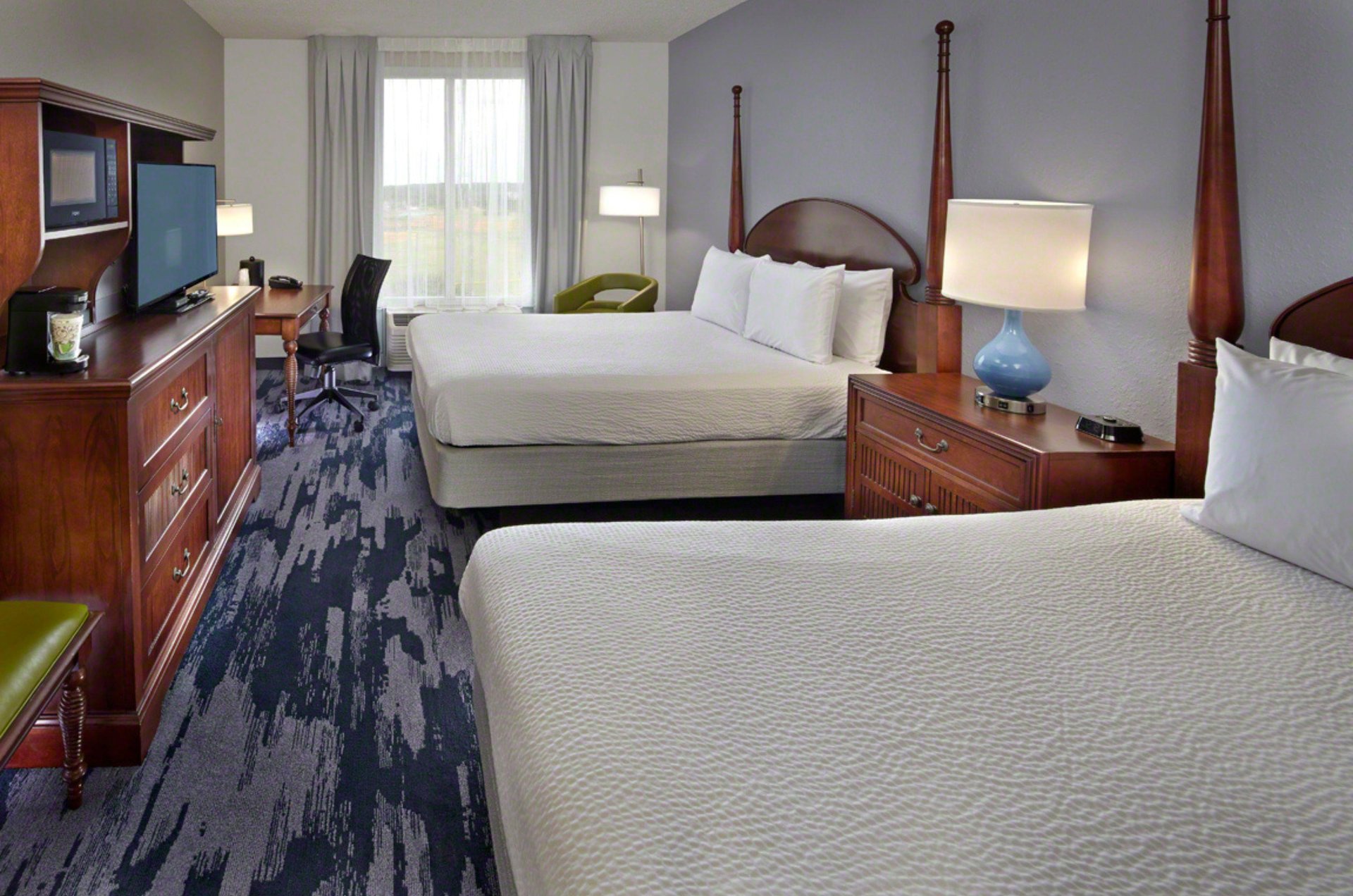 A comfy room with double beds