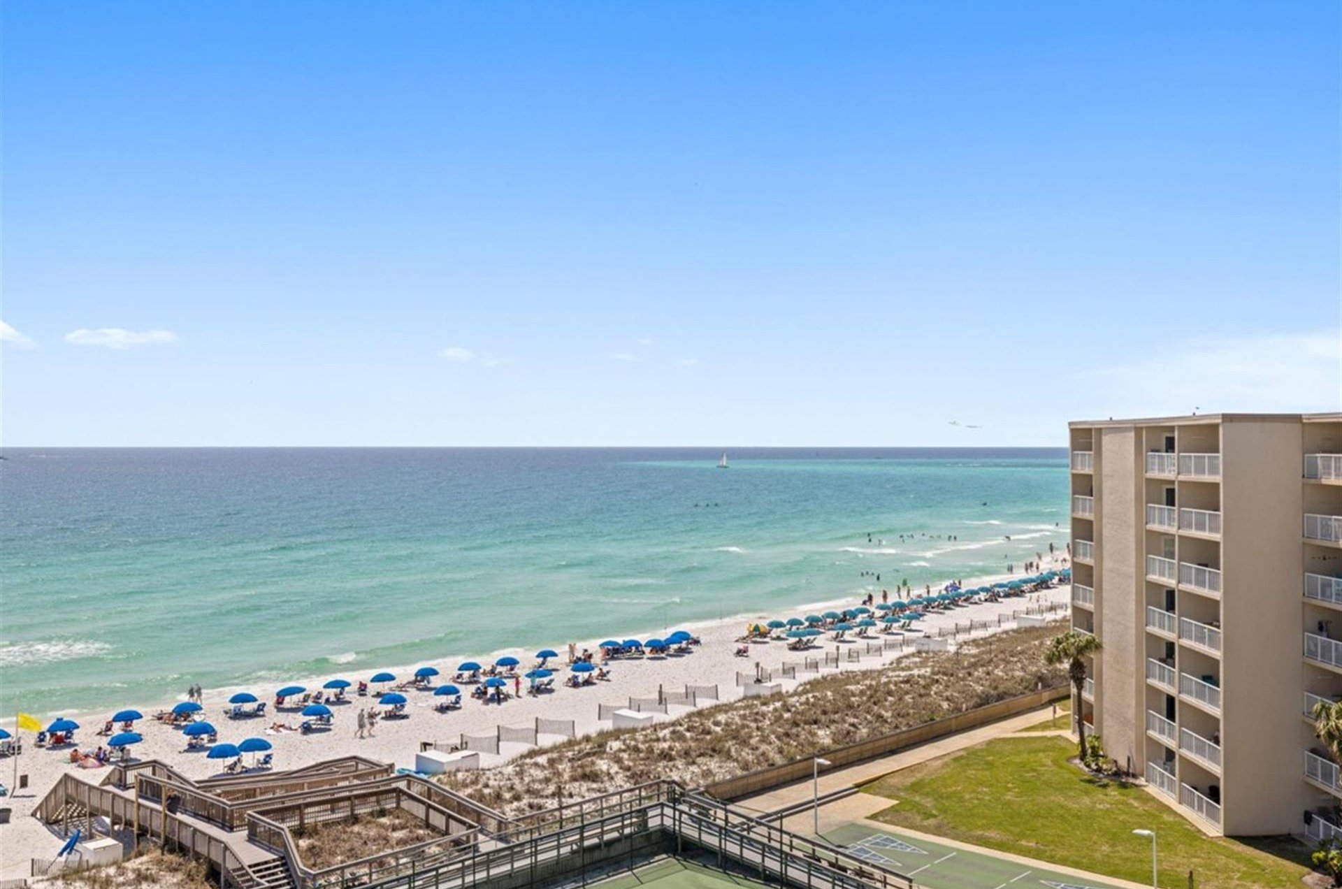 A boardwalk provides private access to the beach.