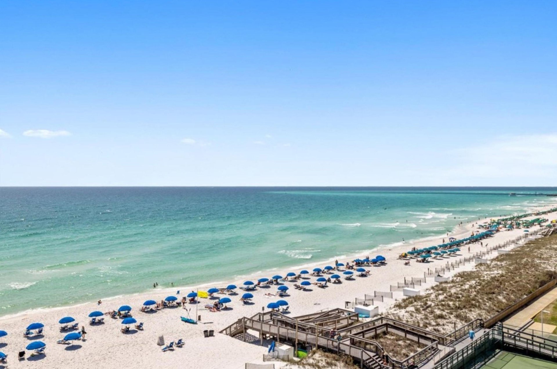 Beach chairs and umbrellas provide guests places to relax on the beach.