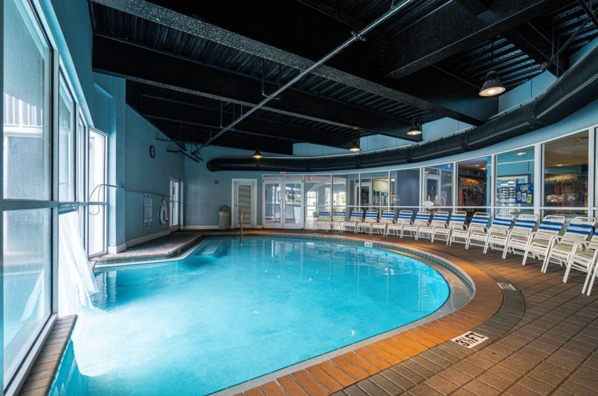 The indoor section of the indooroutdoor swimming pool at Pelican Beach Resort in Destin Florida