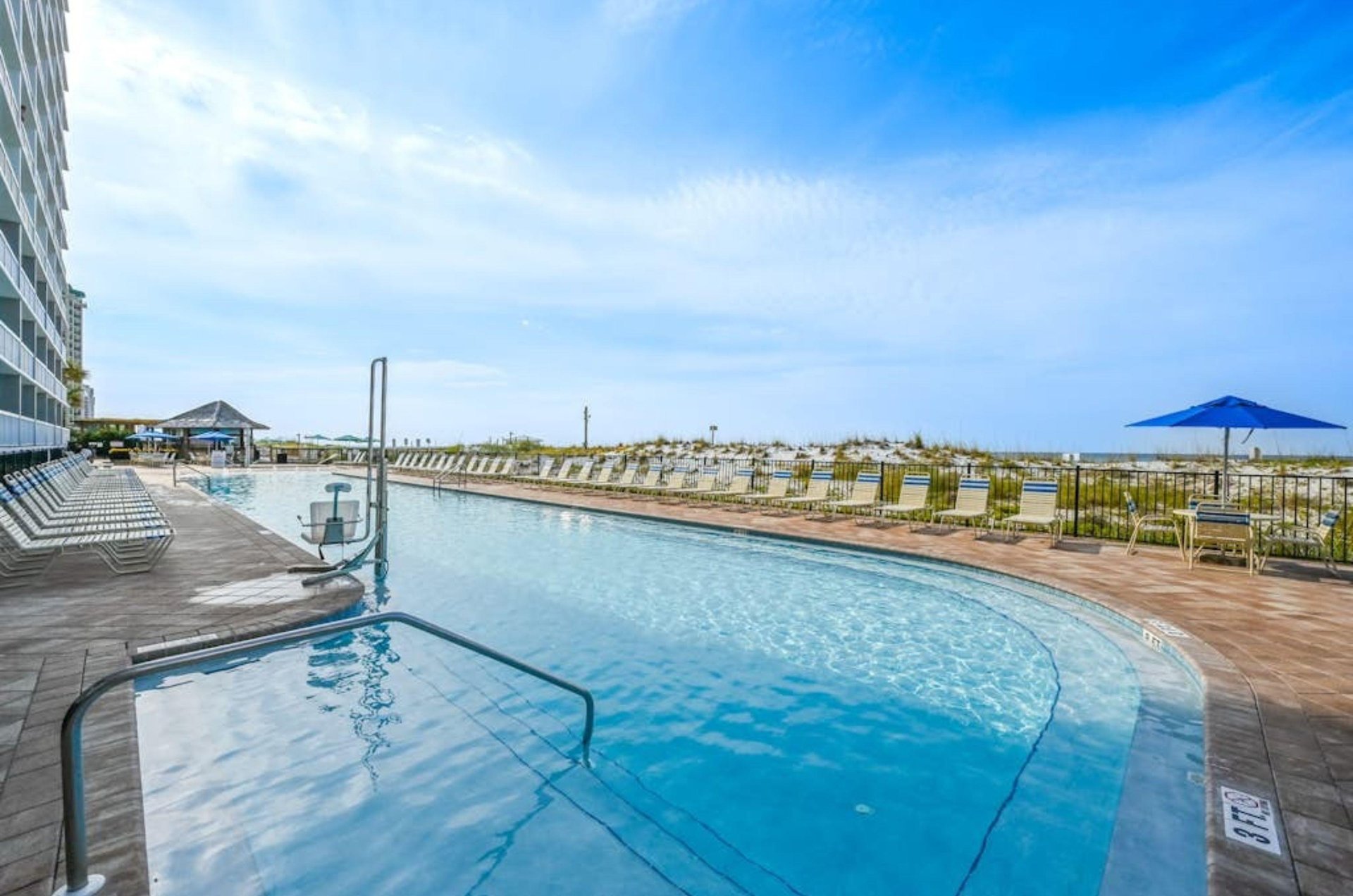 The large, beachfront swimming pool at Pelican Beach Resort