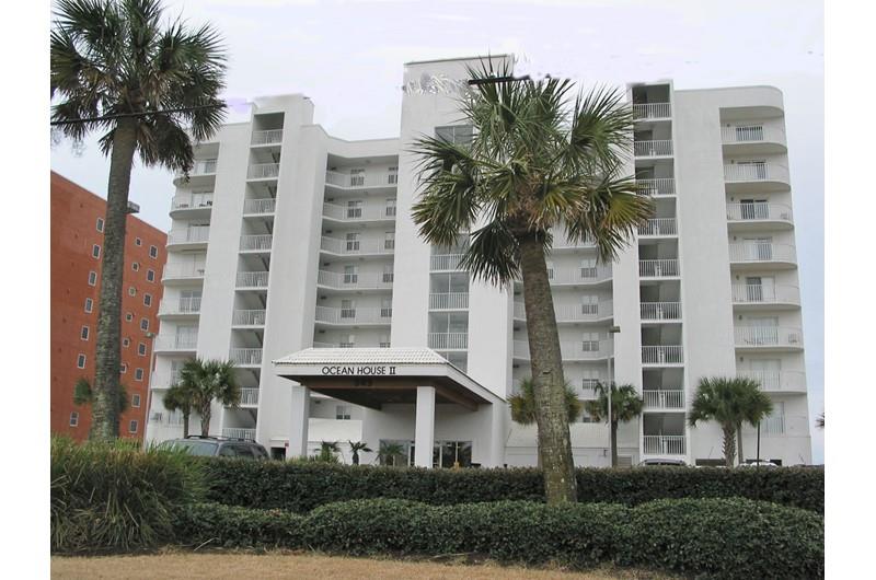 Palmshaded exterior view from the street at Ocean House Gulf Shores