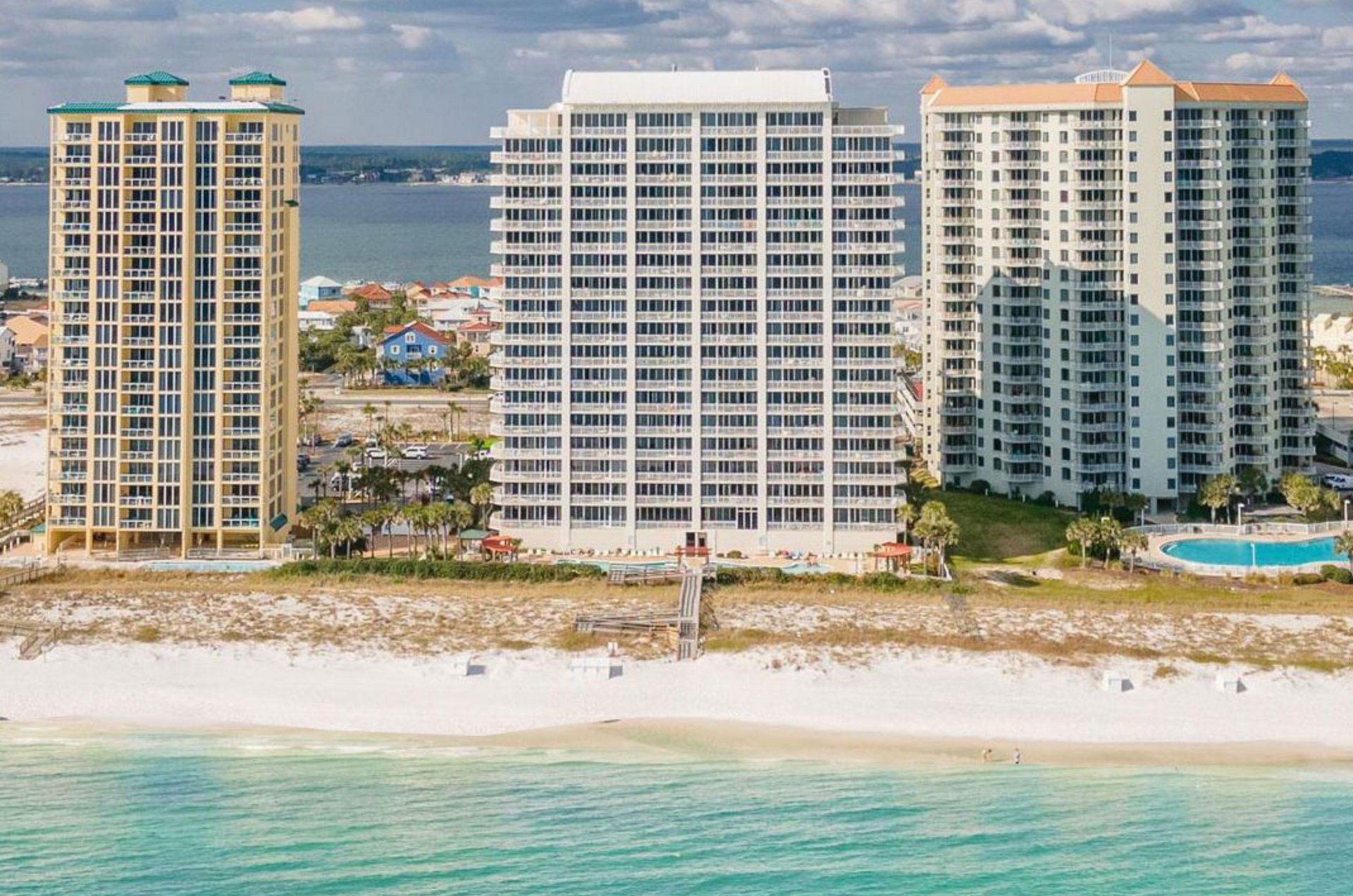 The beachfront facade and boardwalk at the Pearl of Navarre