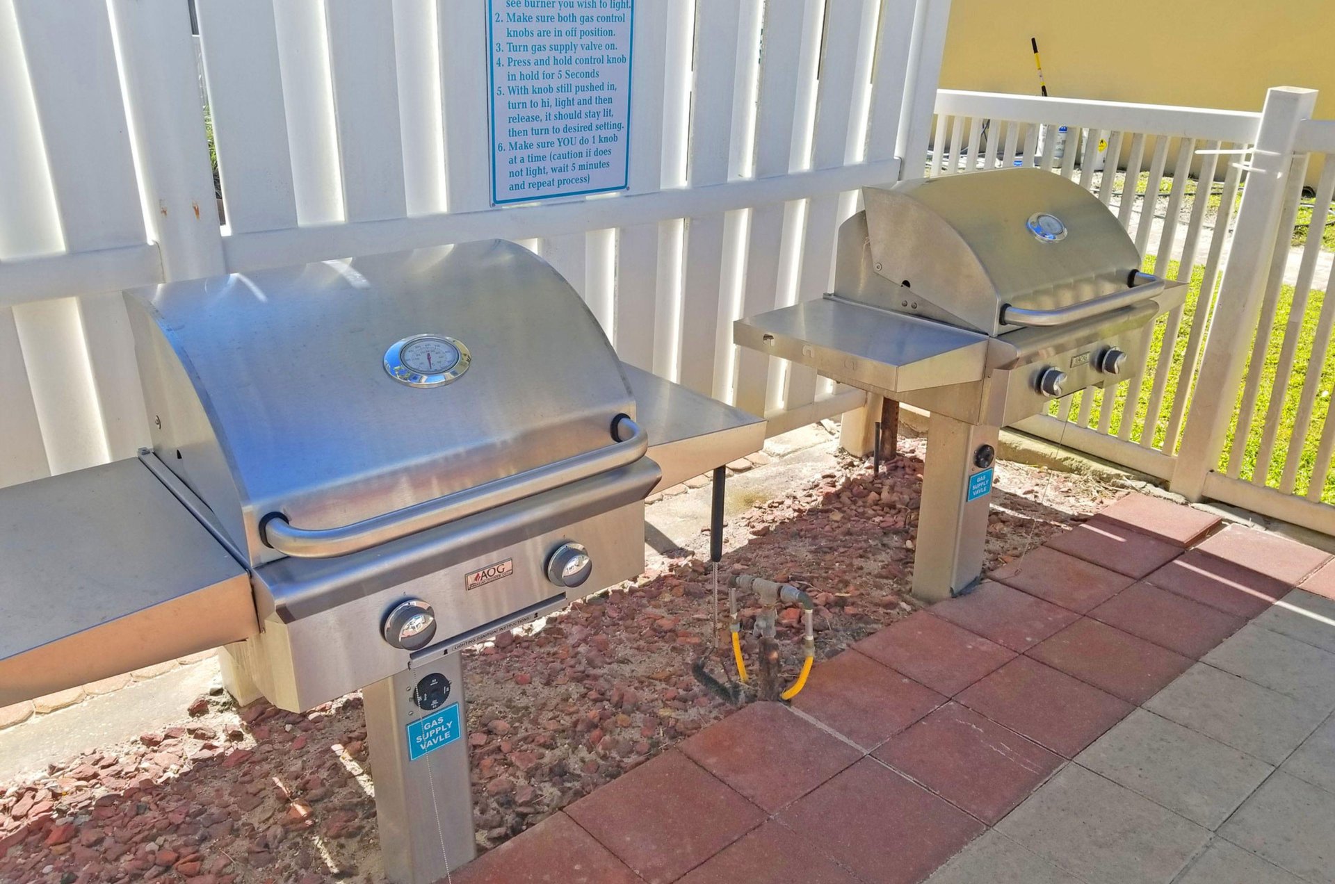 Community gas grills on an outdoor patio at the Pearl of Navarre