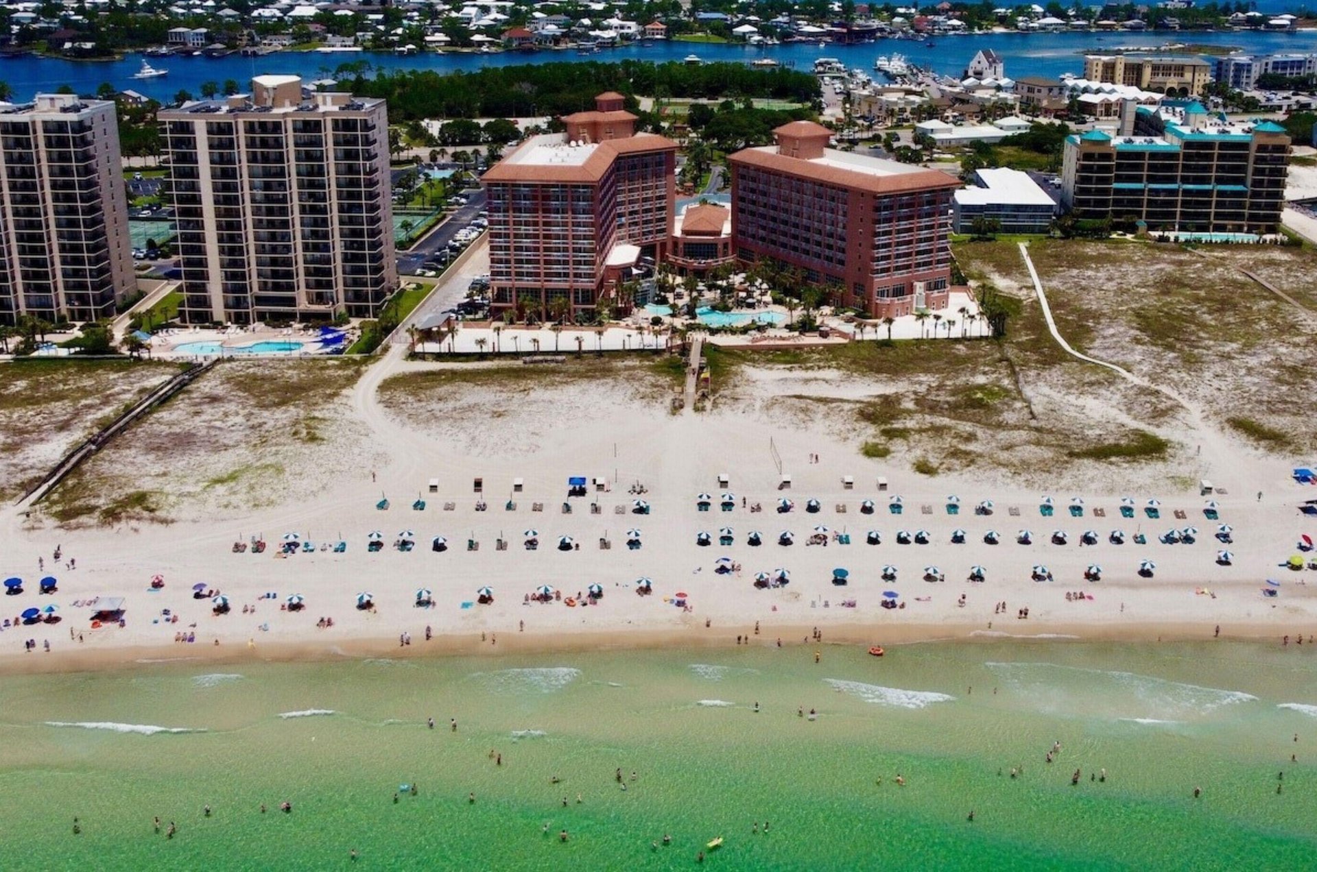 Aerial view of Perdiod Beach Resort and the beach in front of the property