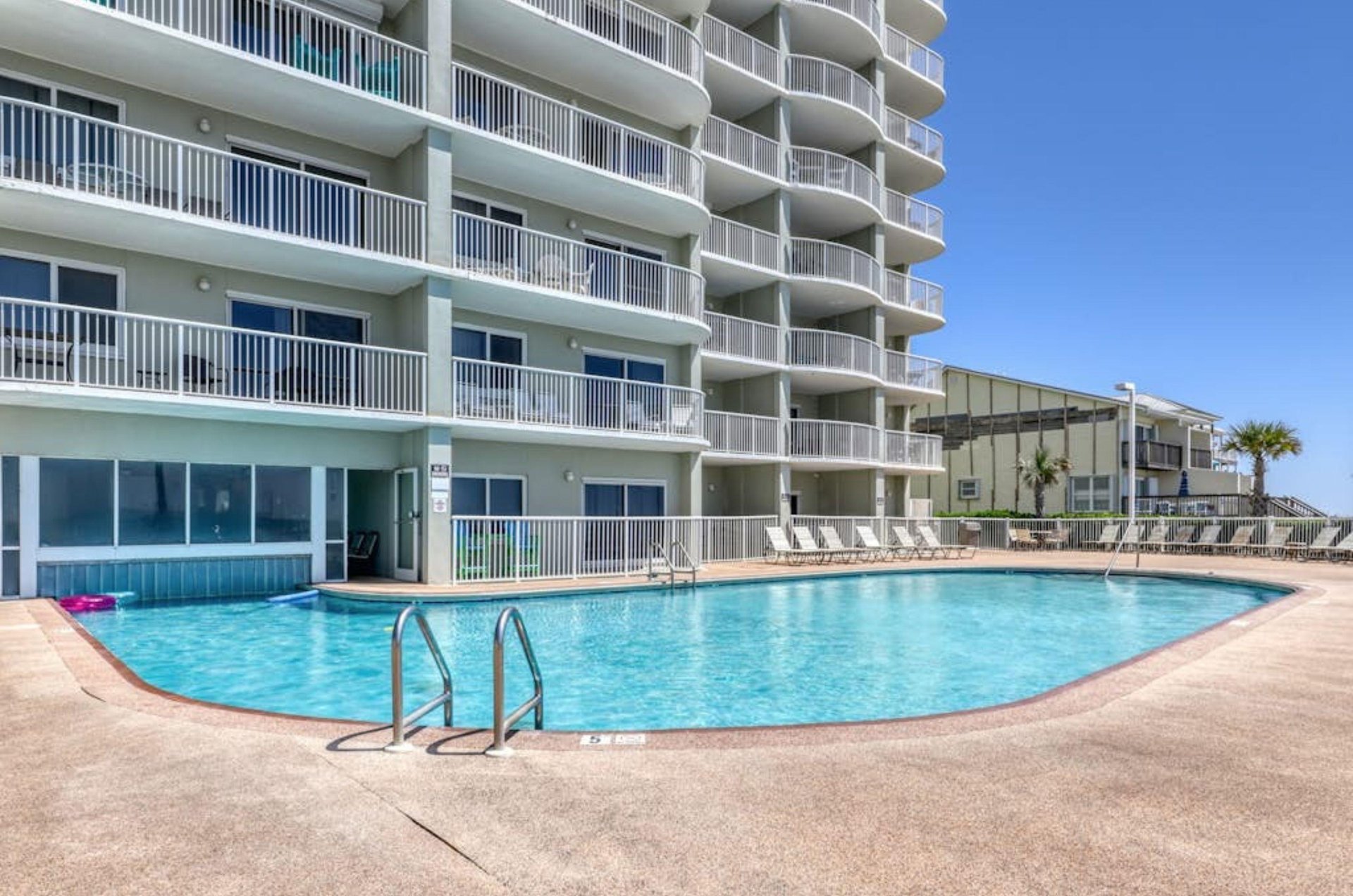 The beachfront swimming pool in front ofTradewinds Condos in Orange Beach Alabama