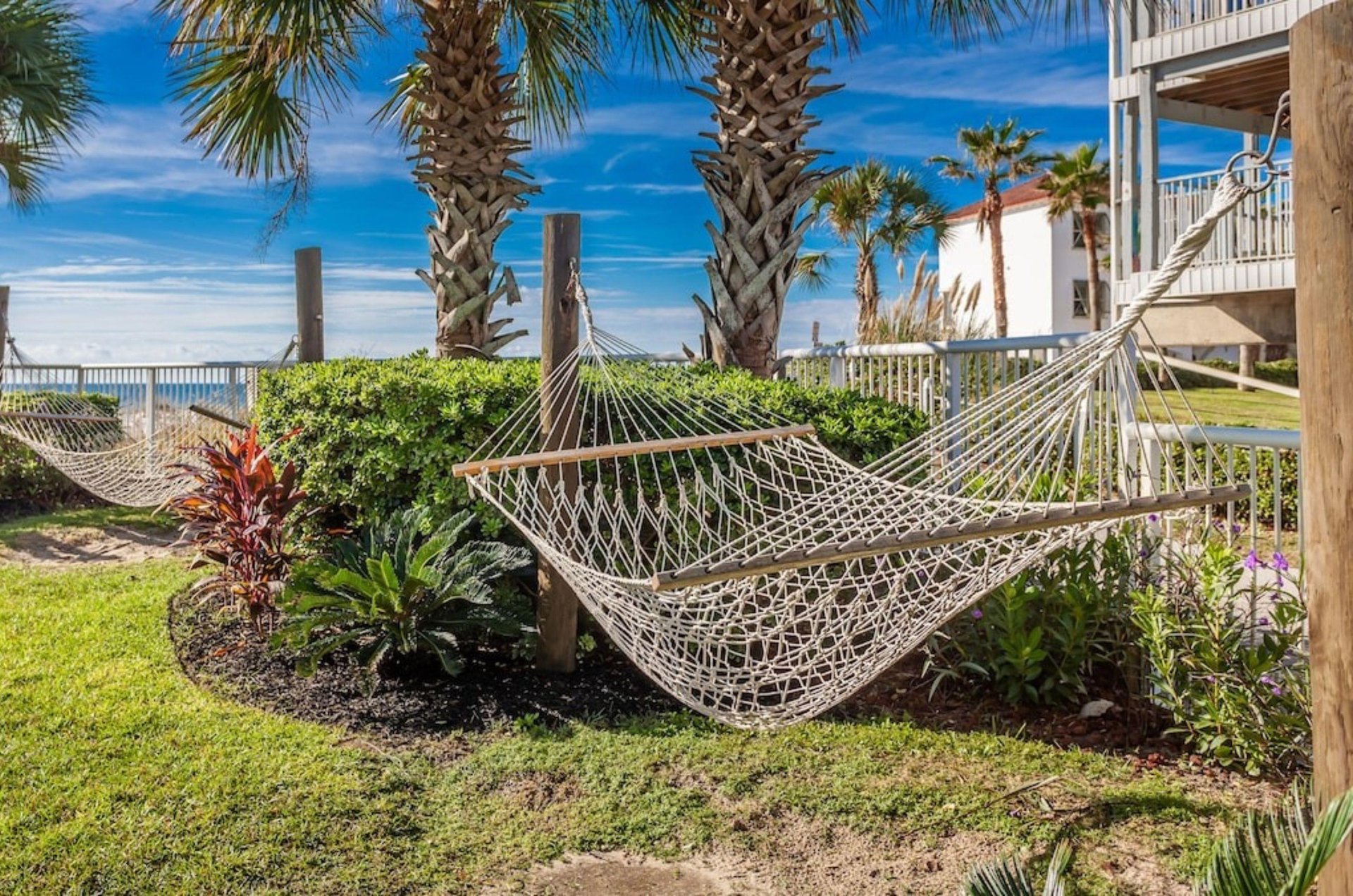 Hammocks on the lawn by the beach at Holiday Inn Express