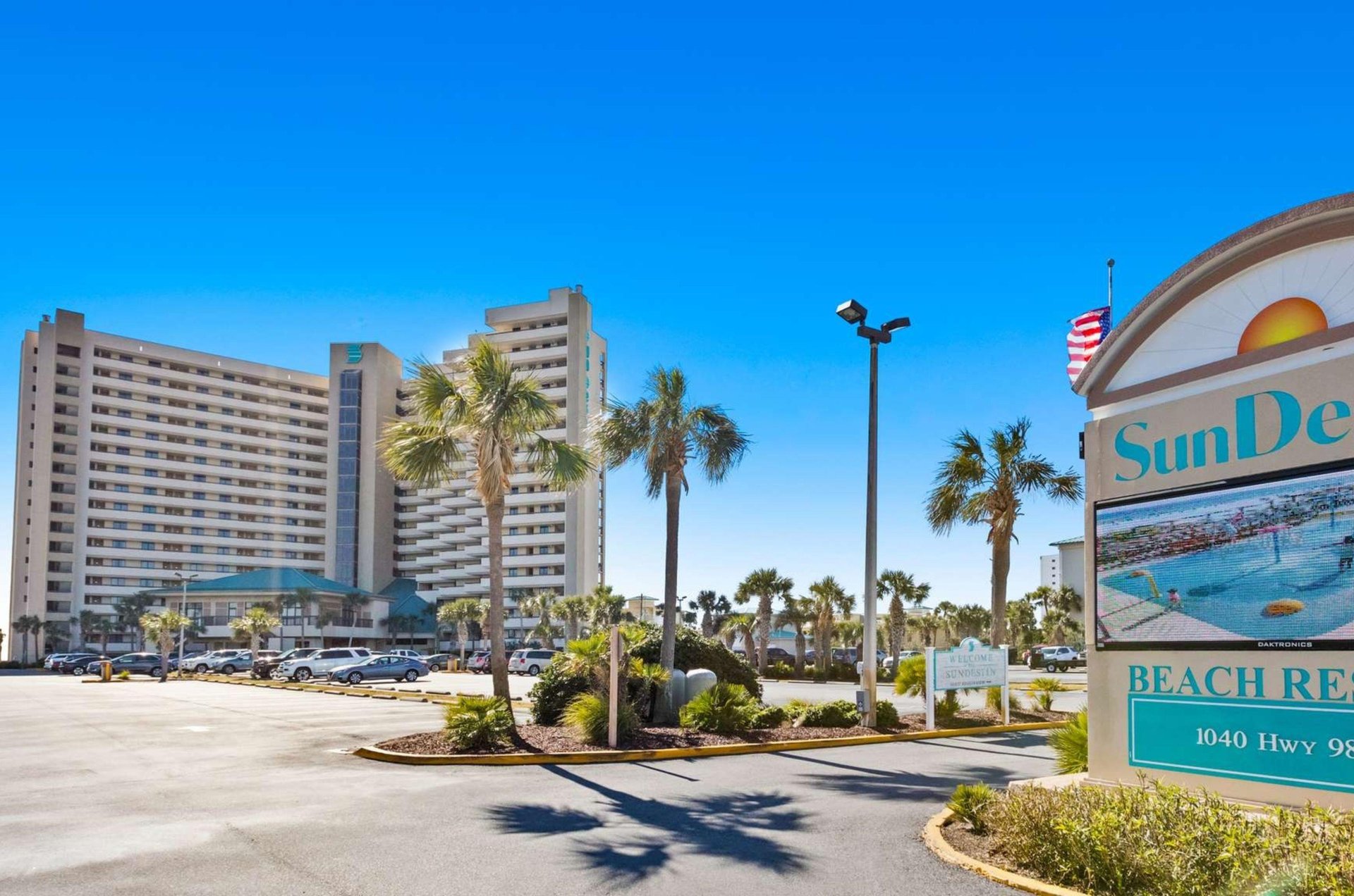 View from the street of SunDestin Beach Resort with the propertys sign out front