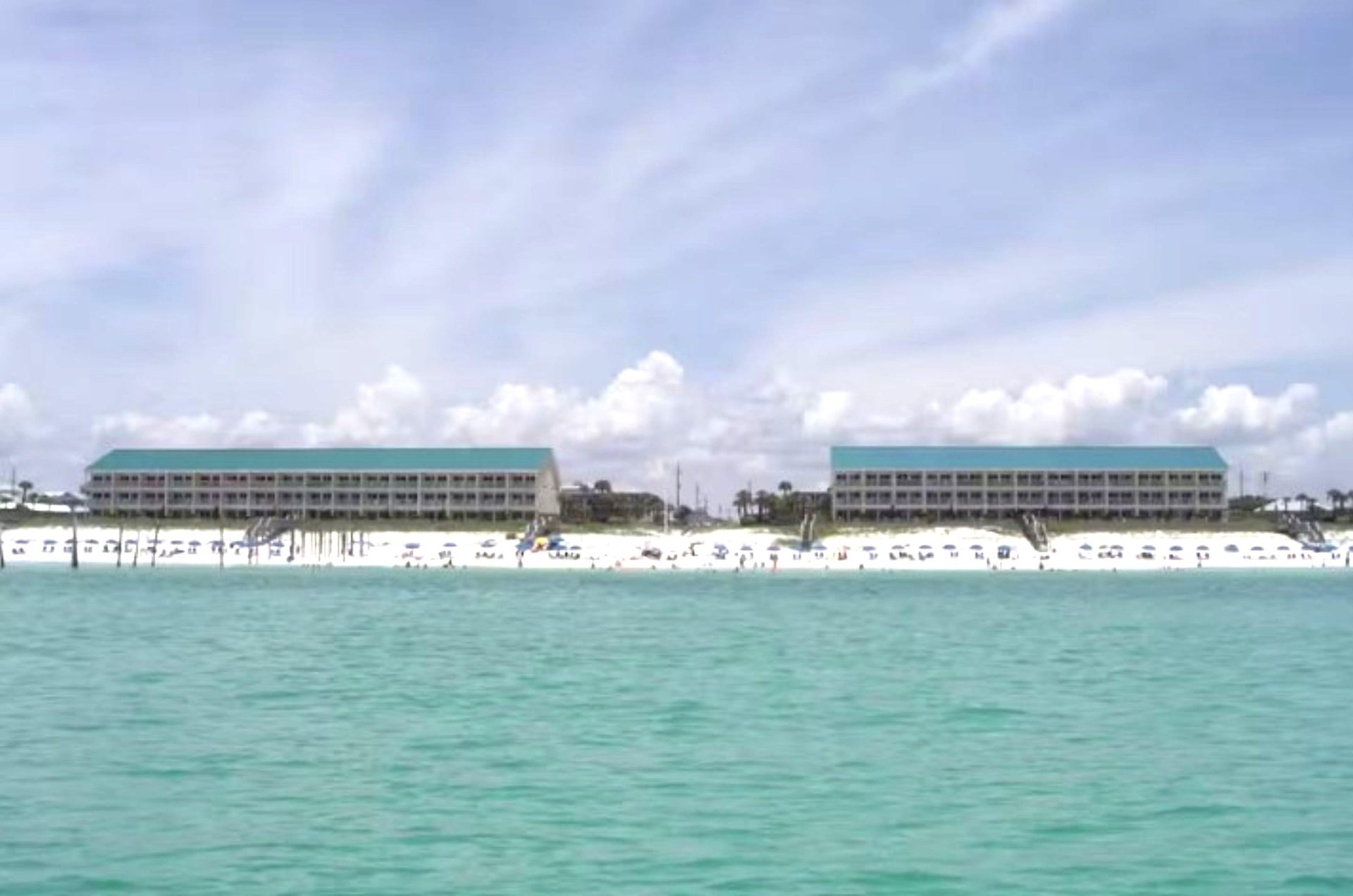 Crystal Sands two threestory buildings.