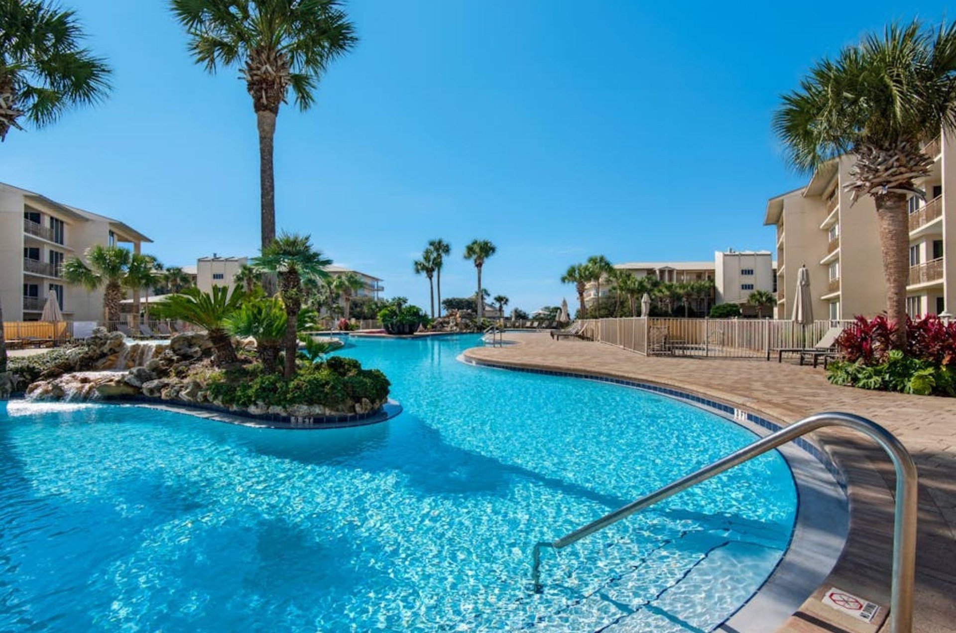 The large lagoonstyle swimming pool at High Pointe Resort in Seacrest Beach, Florida
