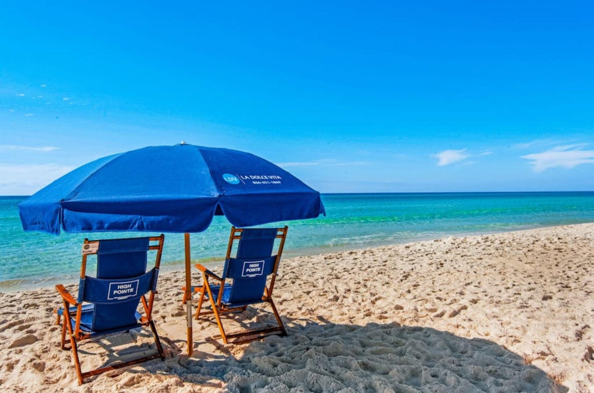 A High Pointe chair and umbrella on the beach
