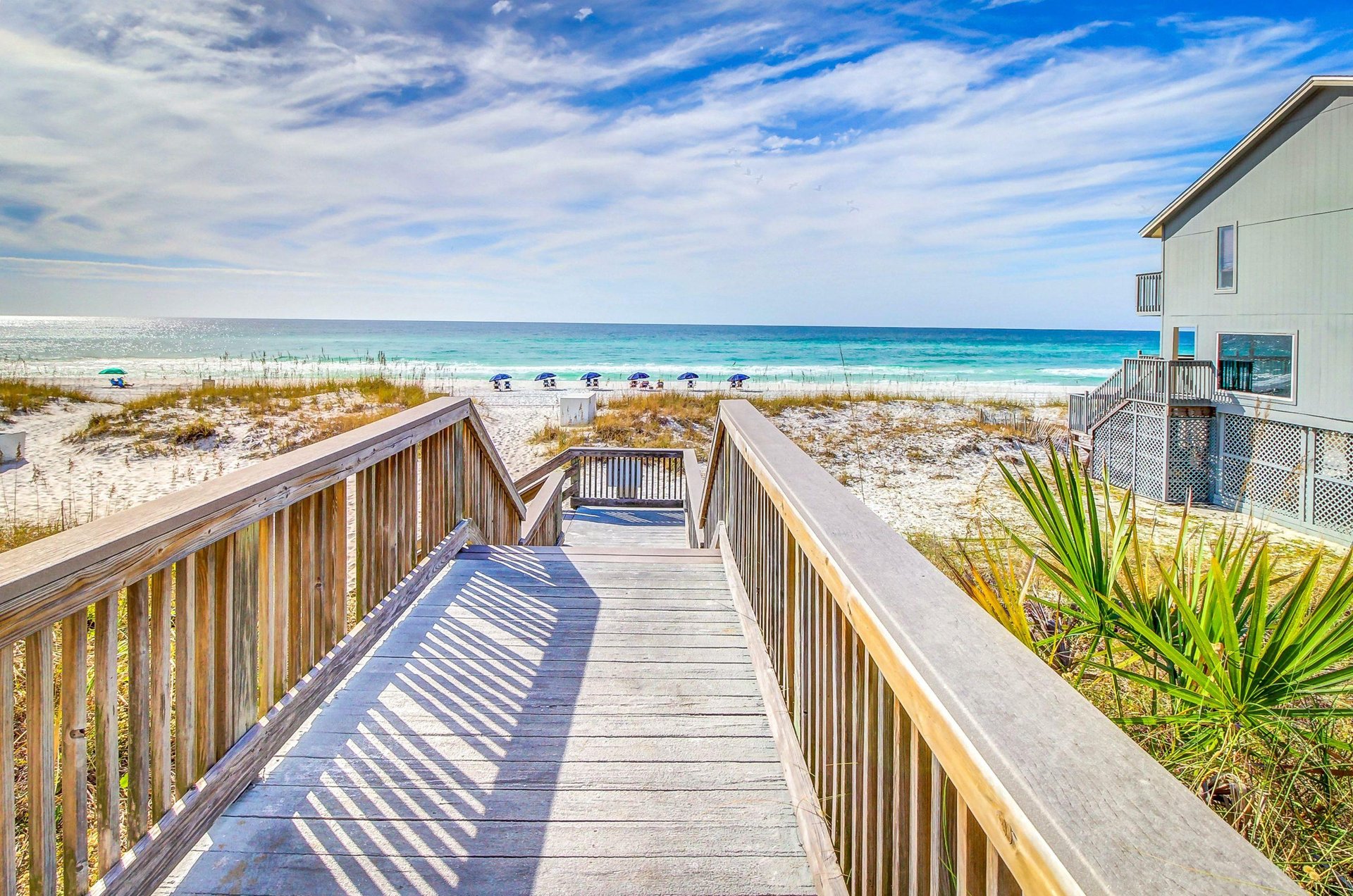 A private boardwalk leads directly to the ivorywhite beach.