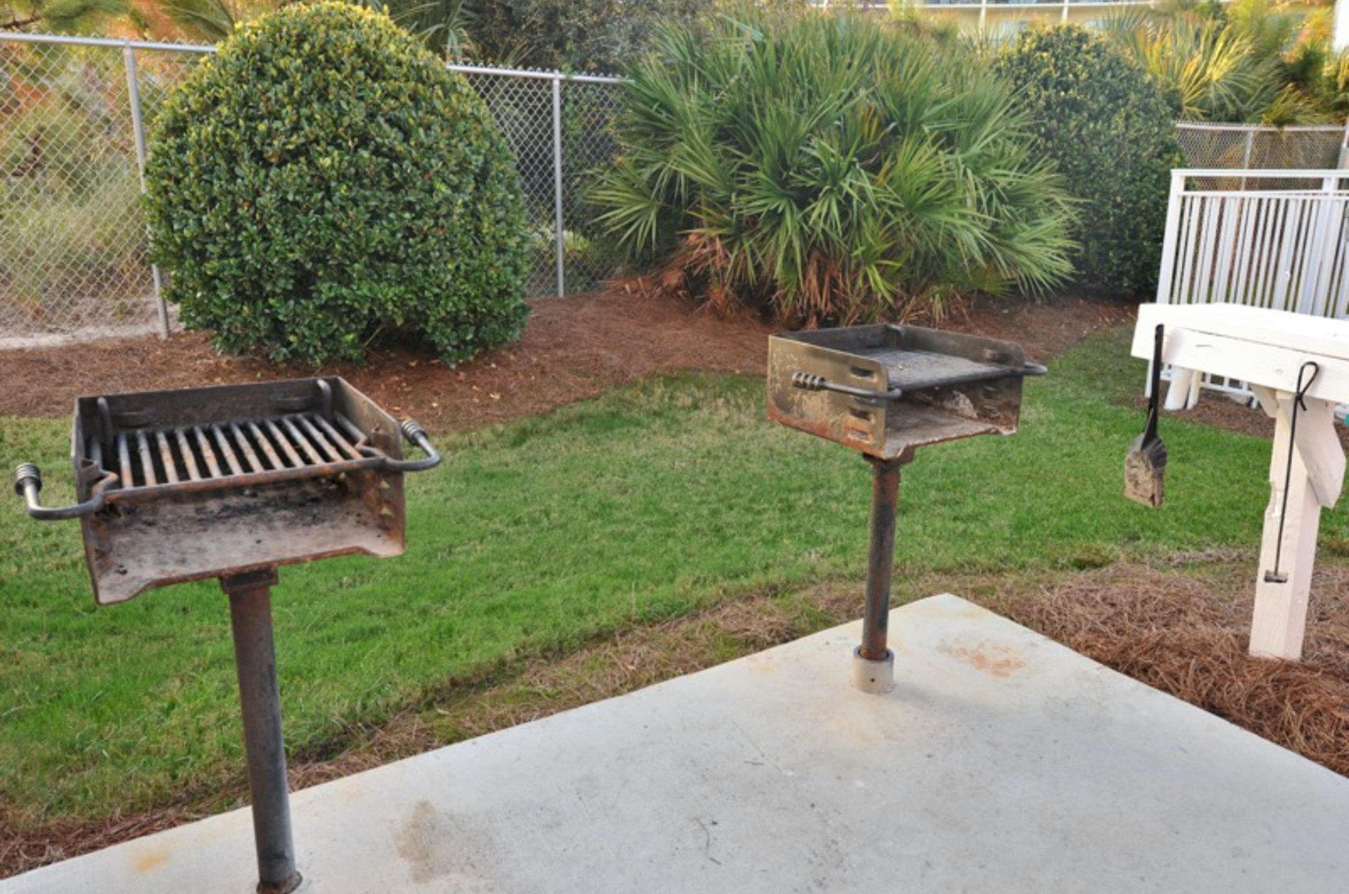 Charcoal grills stand ready for guests to use.