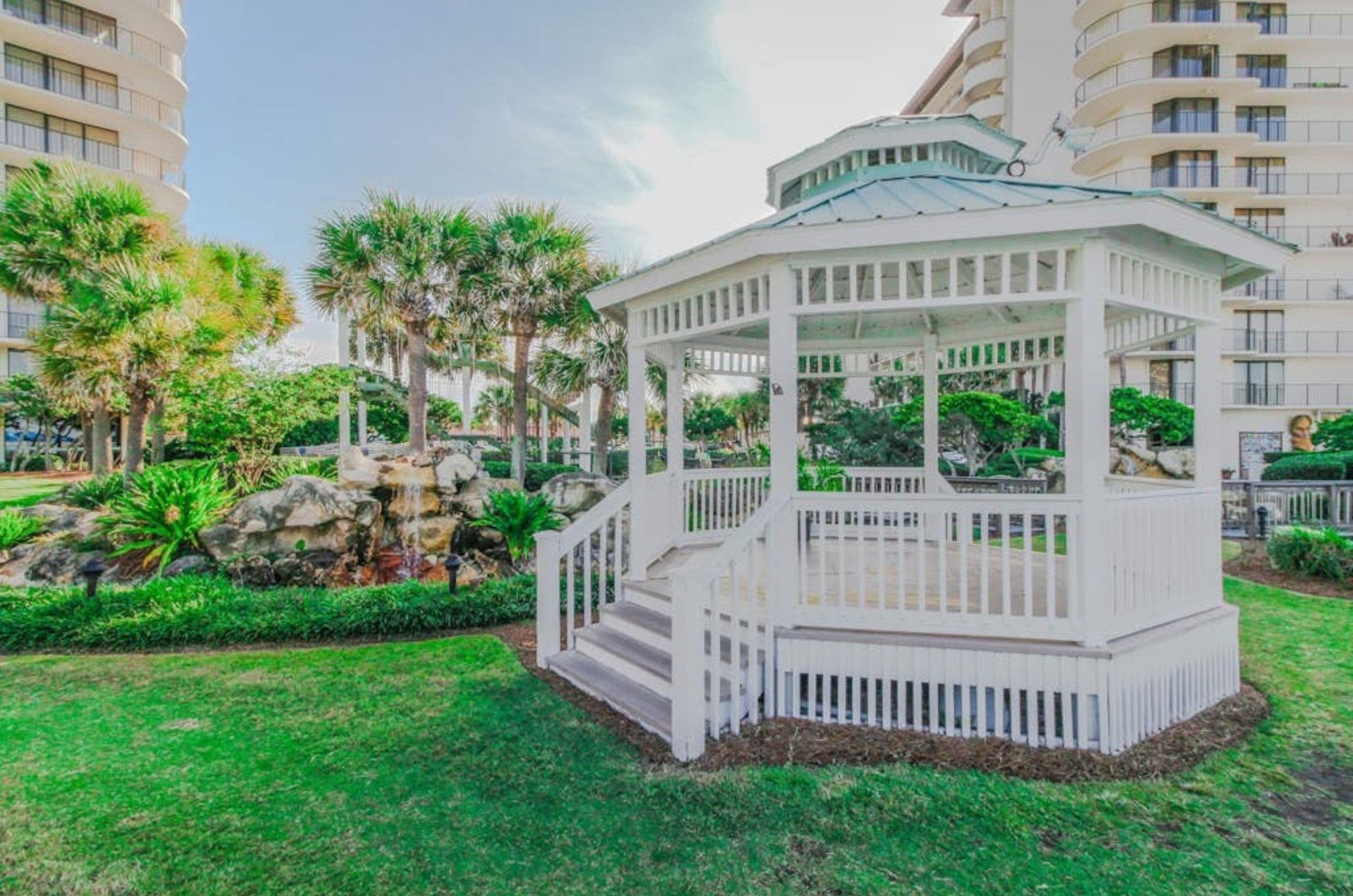 A gazebo on a grassy area at Edgewater Beach and Golf Resort in Panama City Beach Florida
