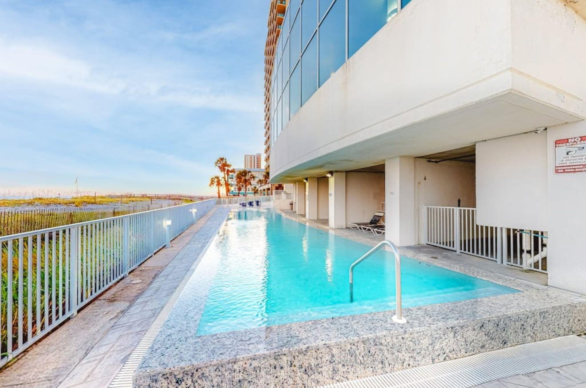 The long outdoor swimming pool at Island Tower in Gulf Shores Alabama