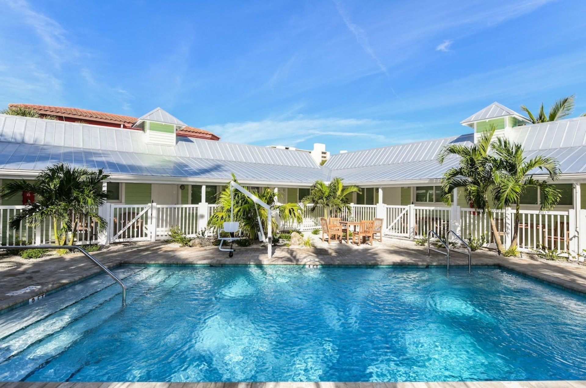 Take a swim in one of the spacious outdoor pools at Tropical Breeze Resort