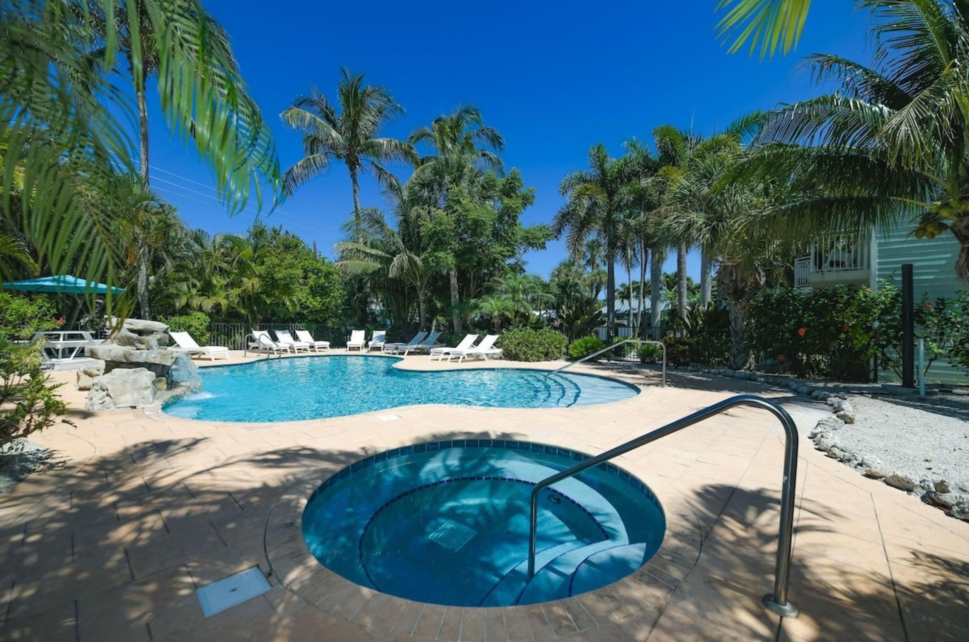 The outdoor hot tub next to the swimming pool at Tropical Breeze Resort in Siesta Key Florida