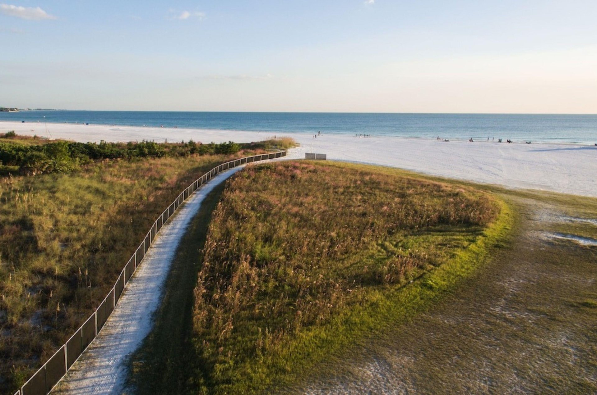 Aerial view of the beach with a pathway leading to the Gulf in Siesta Key Florida