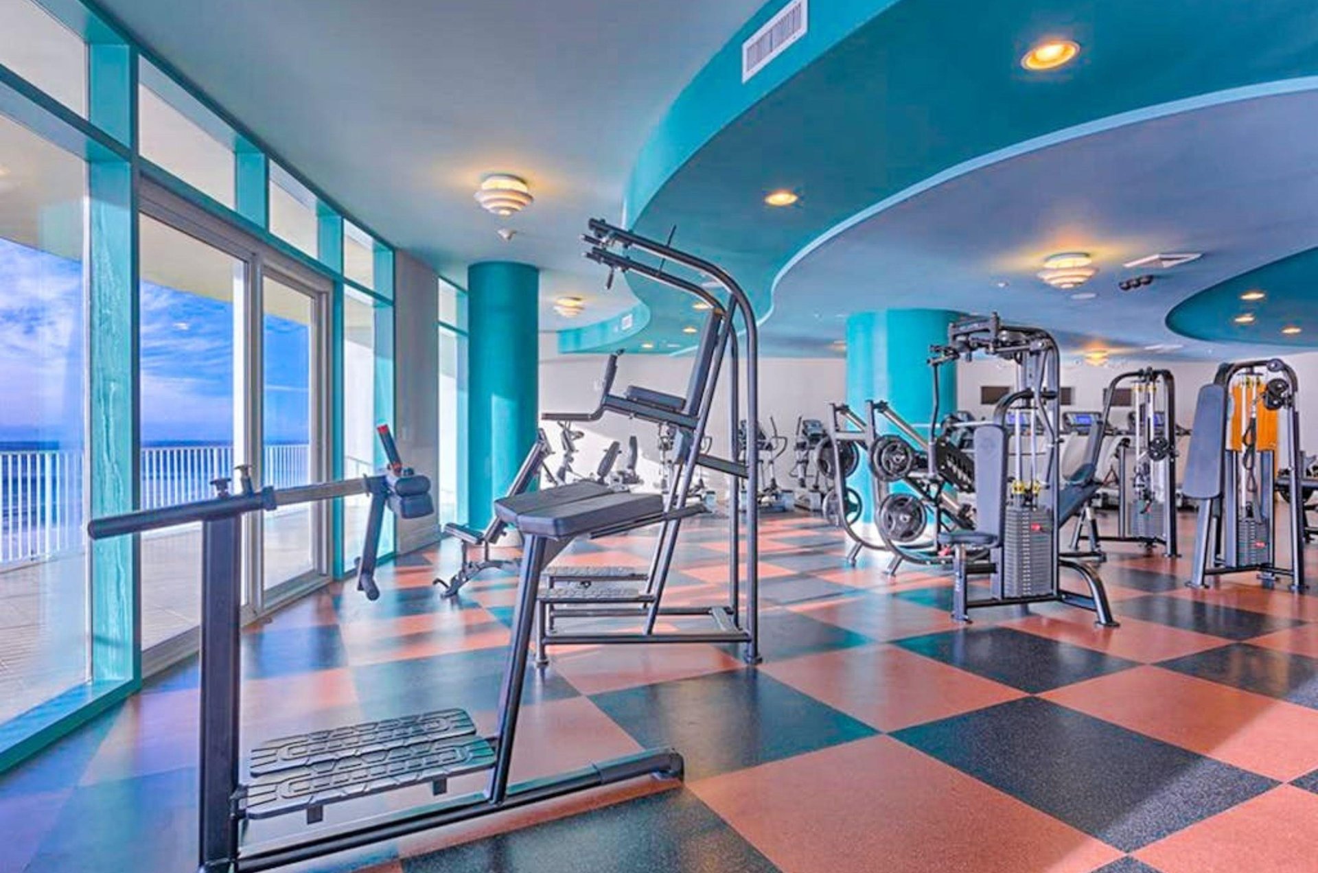 The fitness center includes amazing floortoceiling windows overlooking the Gulf