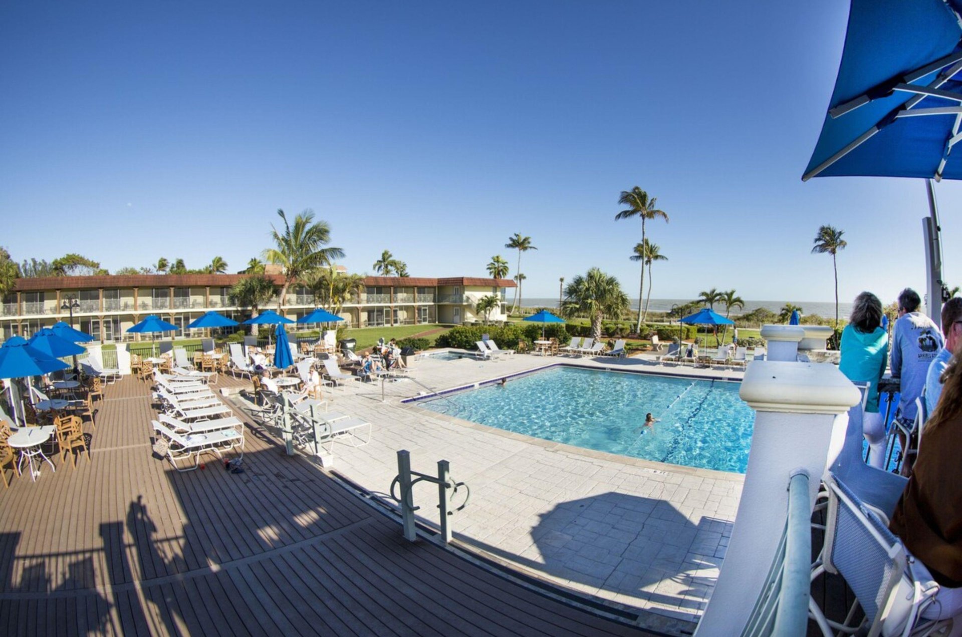 The outdoor pool is only steps away from the beach