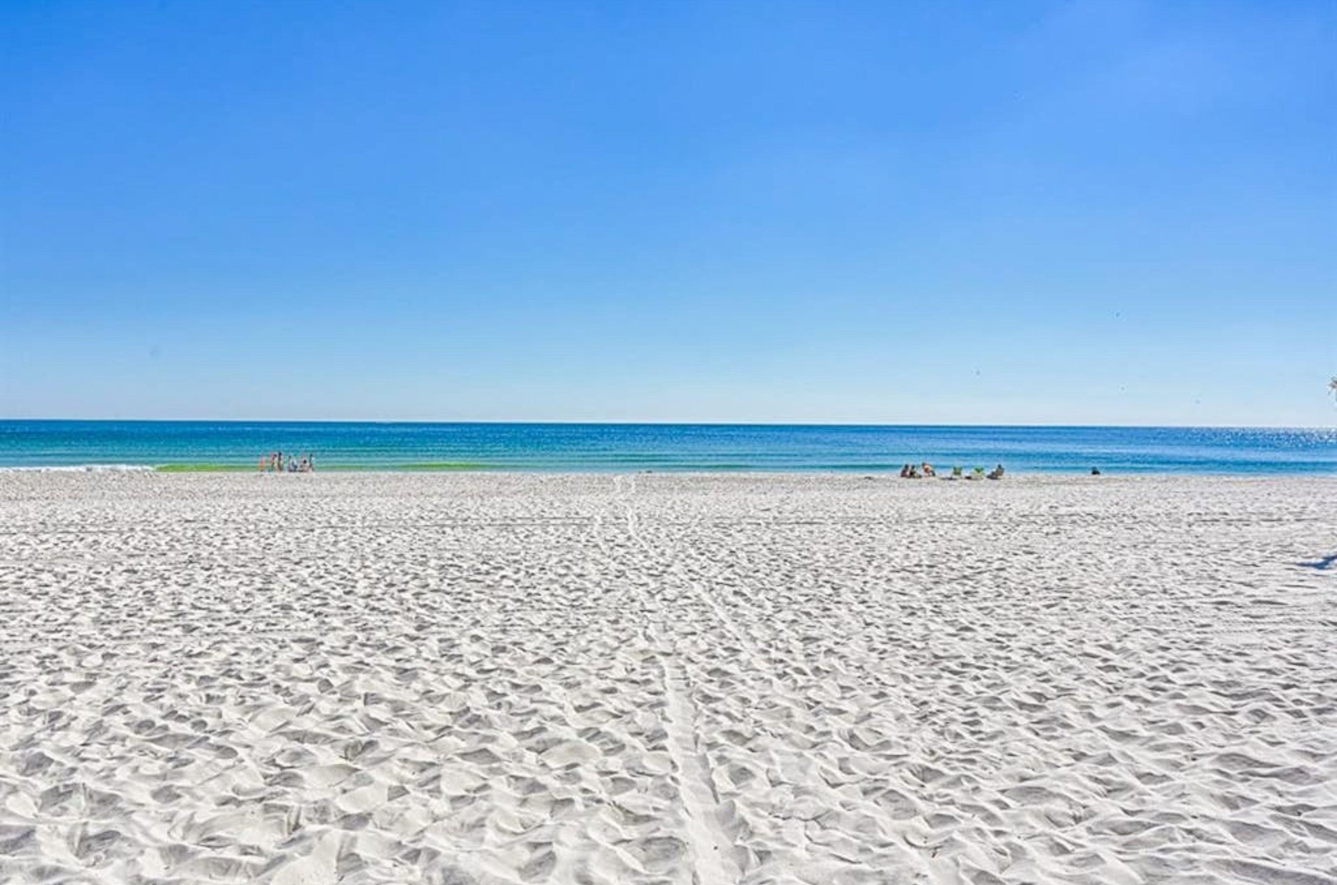The sandy white beaches and Gulf in front of Seascape