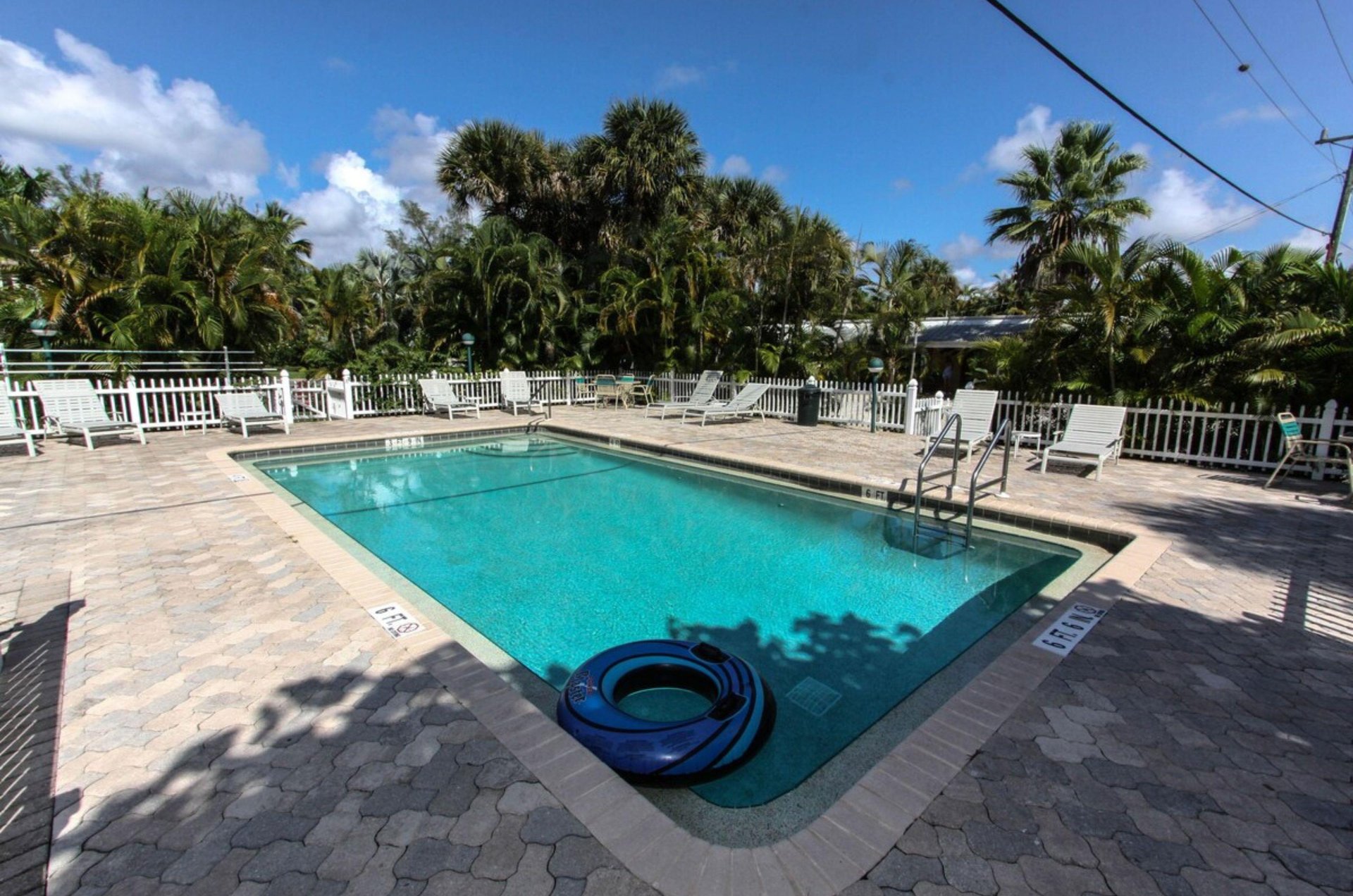 Relax by the outdoor heated pool at Anchor Inn and Cottages