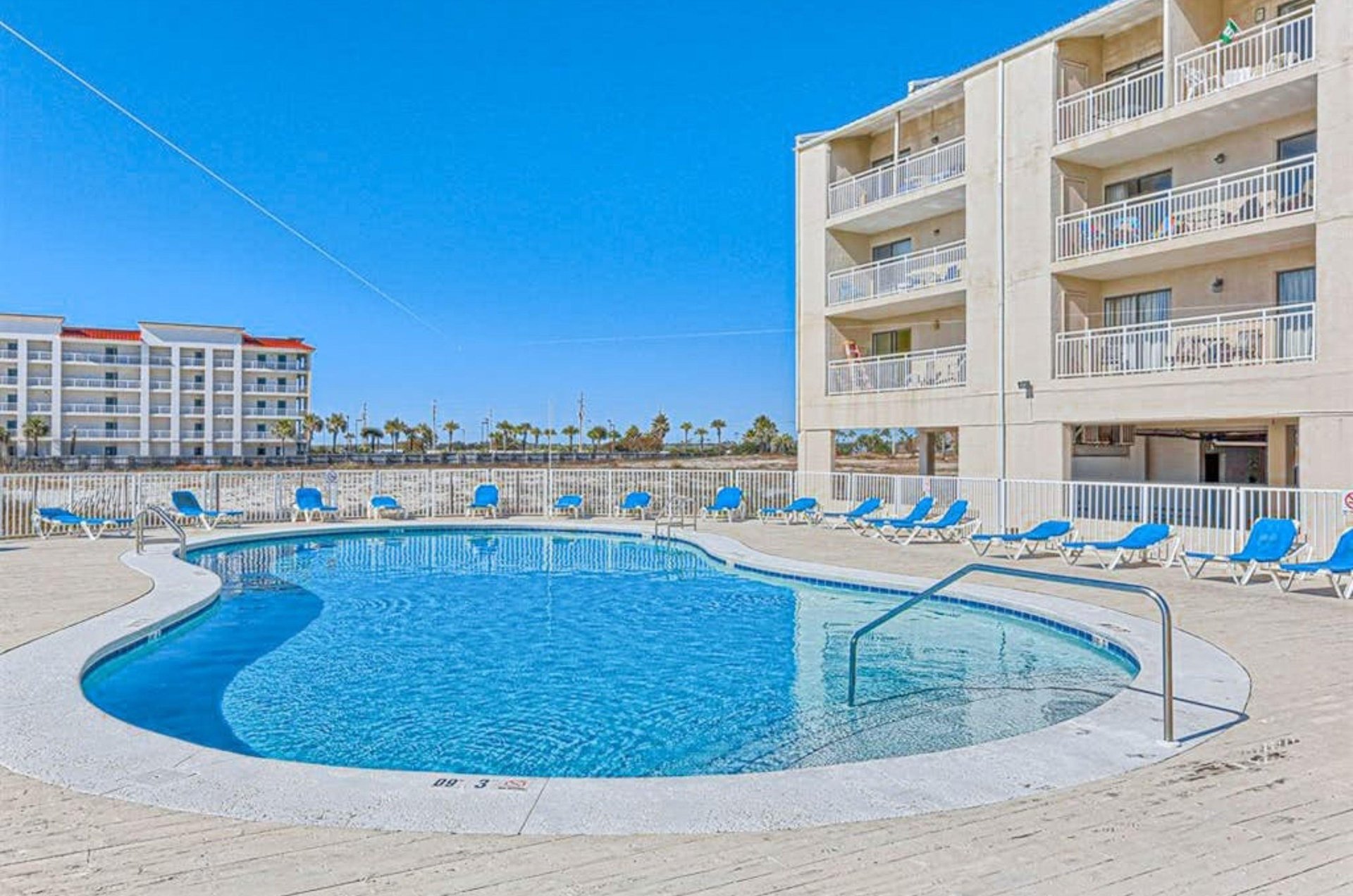 The beachfront swimming pool in front of Sugar Beach Condos in Orange Beach Alabama