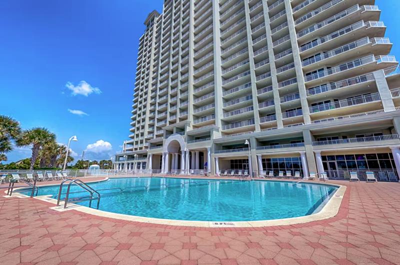 The swimming pool and sundeck are expansive and inviting.