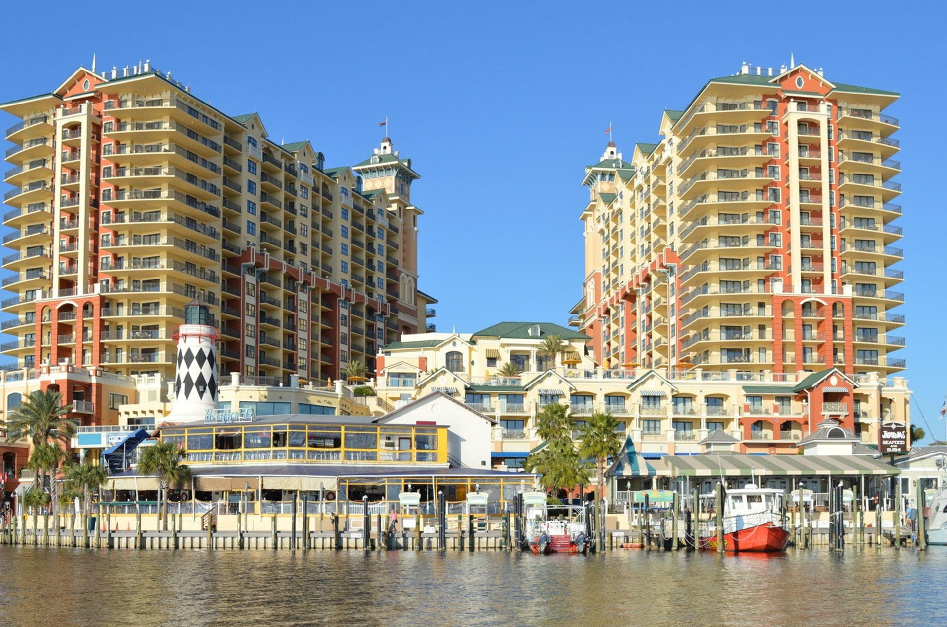 Emerald Grande is a mixture of highrise condo buildings, restaurants, and shops nestled beside the Destin Harbor.