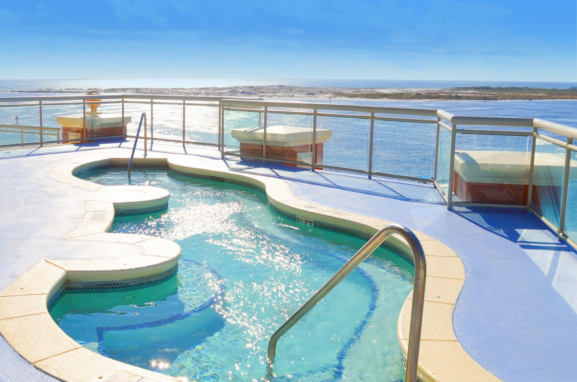 An Emerald Grande hot tub with Destin Harbor and the Gulf beyond.
