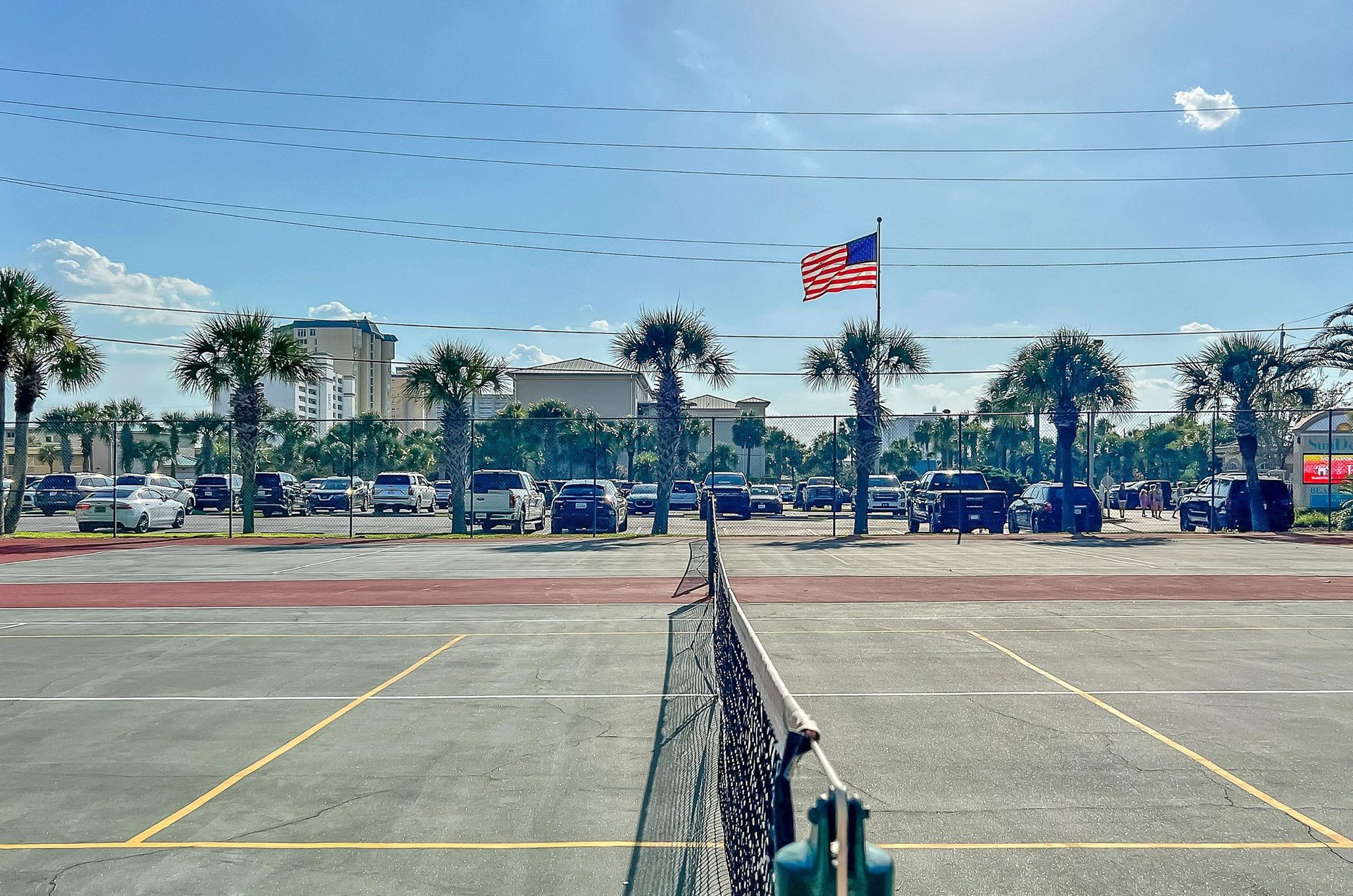 The complexs tennis courts stand ready for friendly competitions.