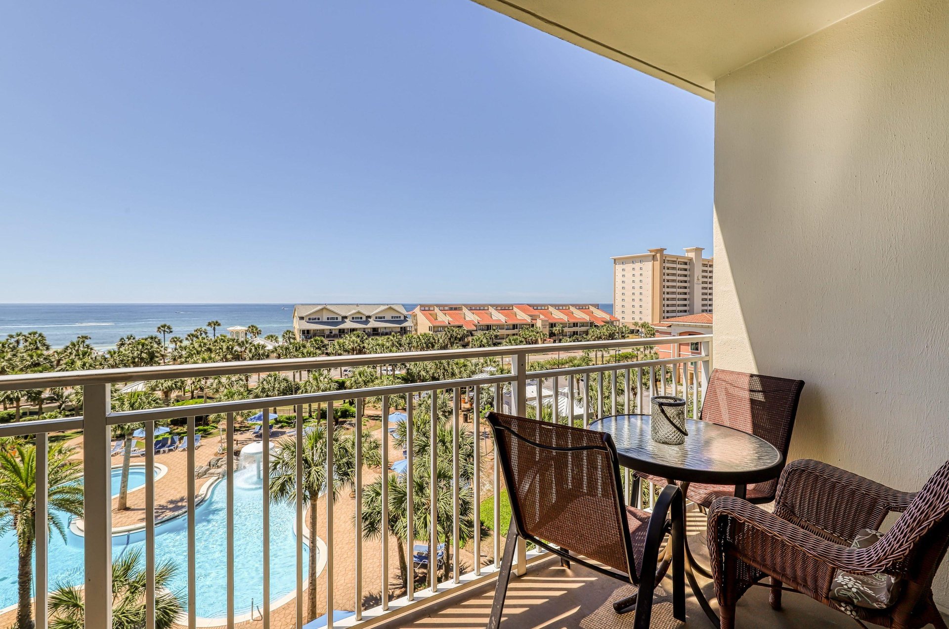View of the pool and Gulf from a balcony