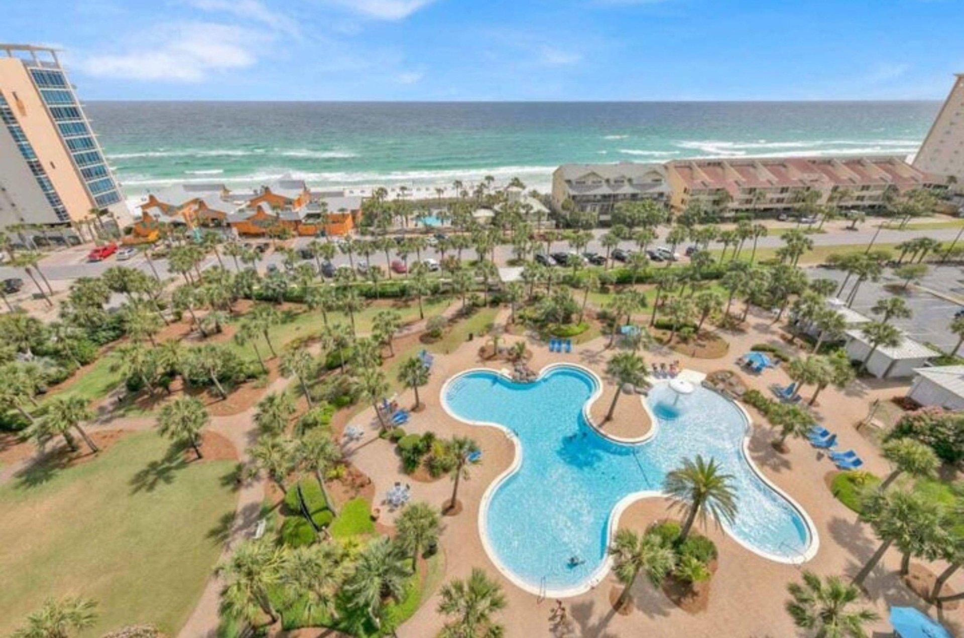 And aerial view of the grounds, pool, and Gulf