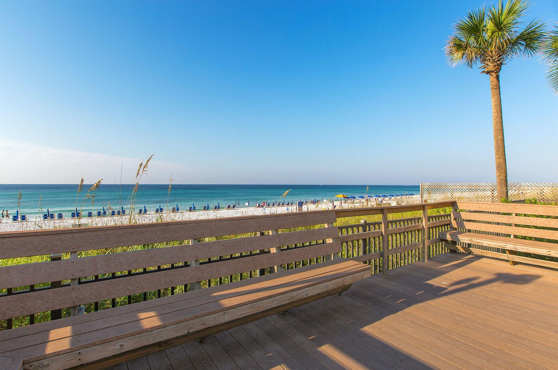 A deck with seating looking out over the coastline