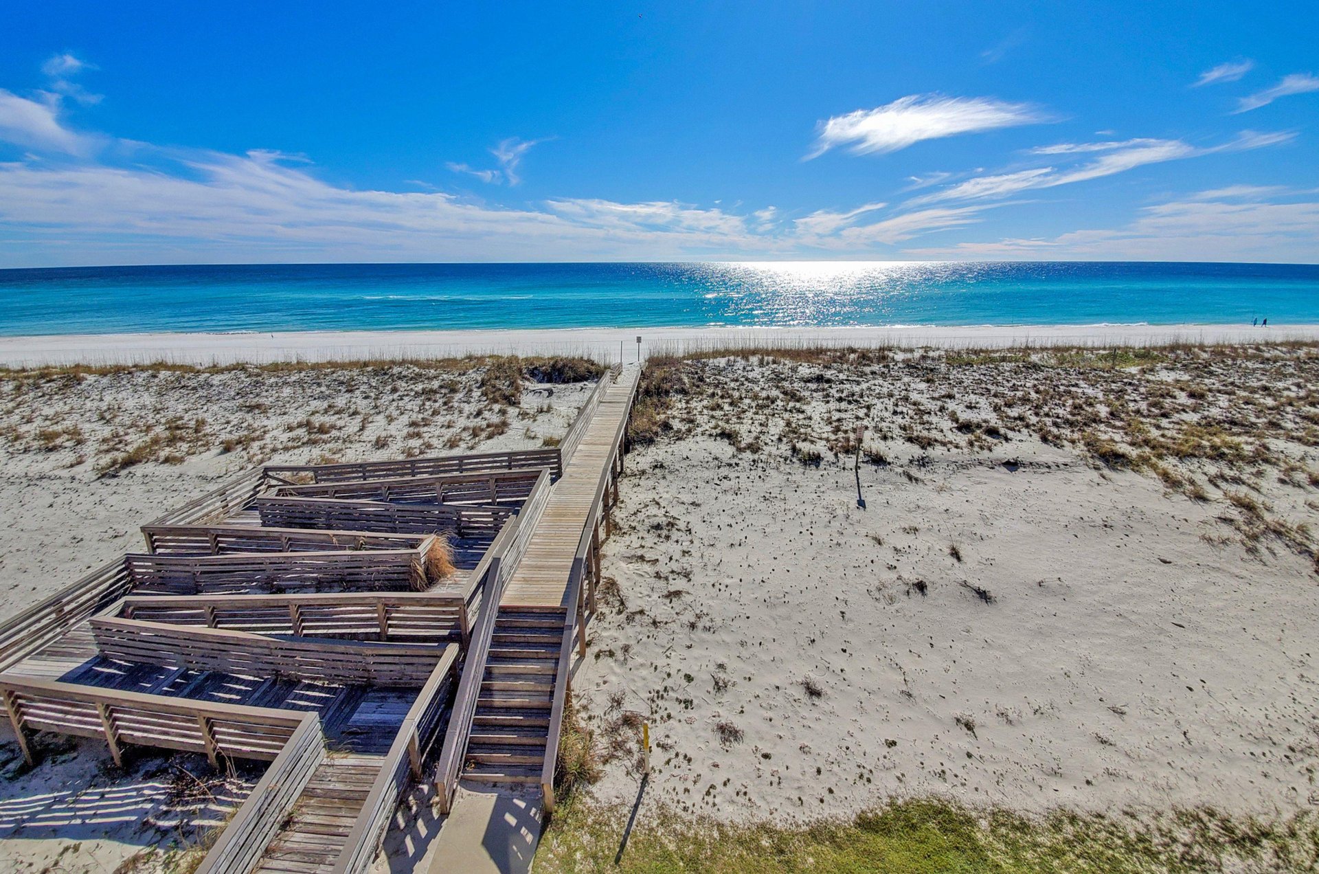 Stroll down the propertys boardwalk to the Gulf