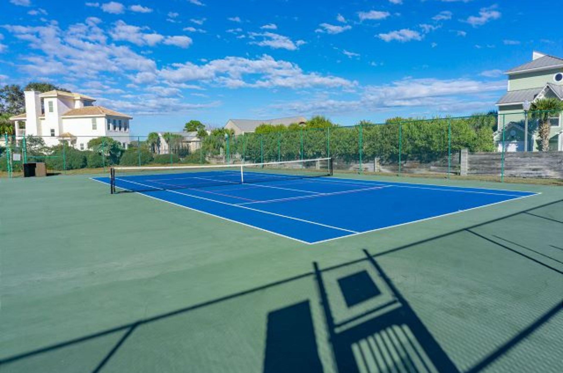 This tennis court stands ready for friendly competition.