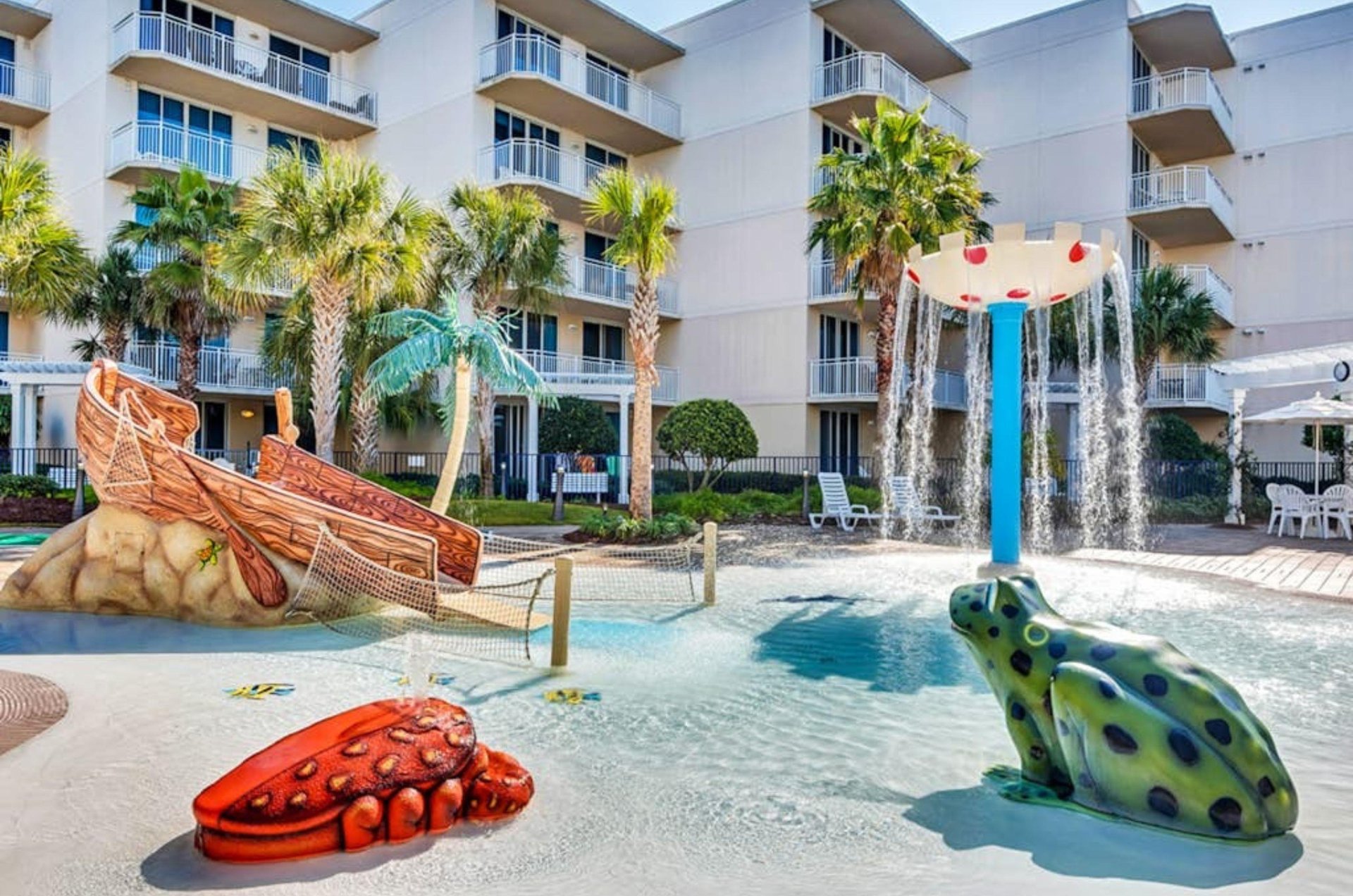 The shallow portion of the swimming pool with water fountain and animal statutes at Waterscape Condominiums