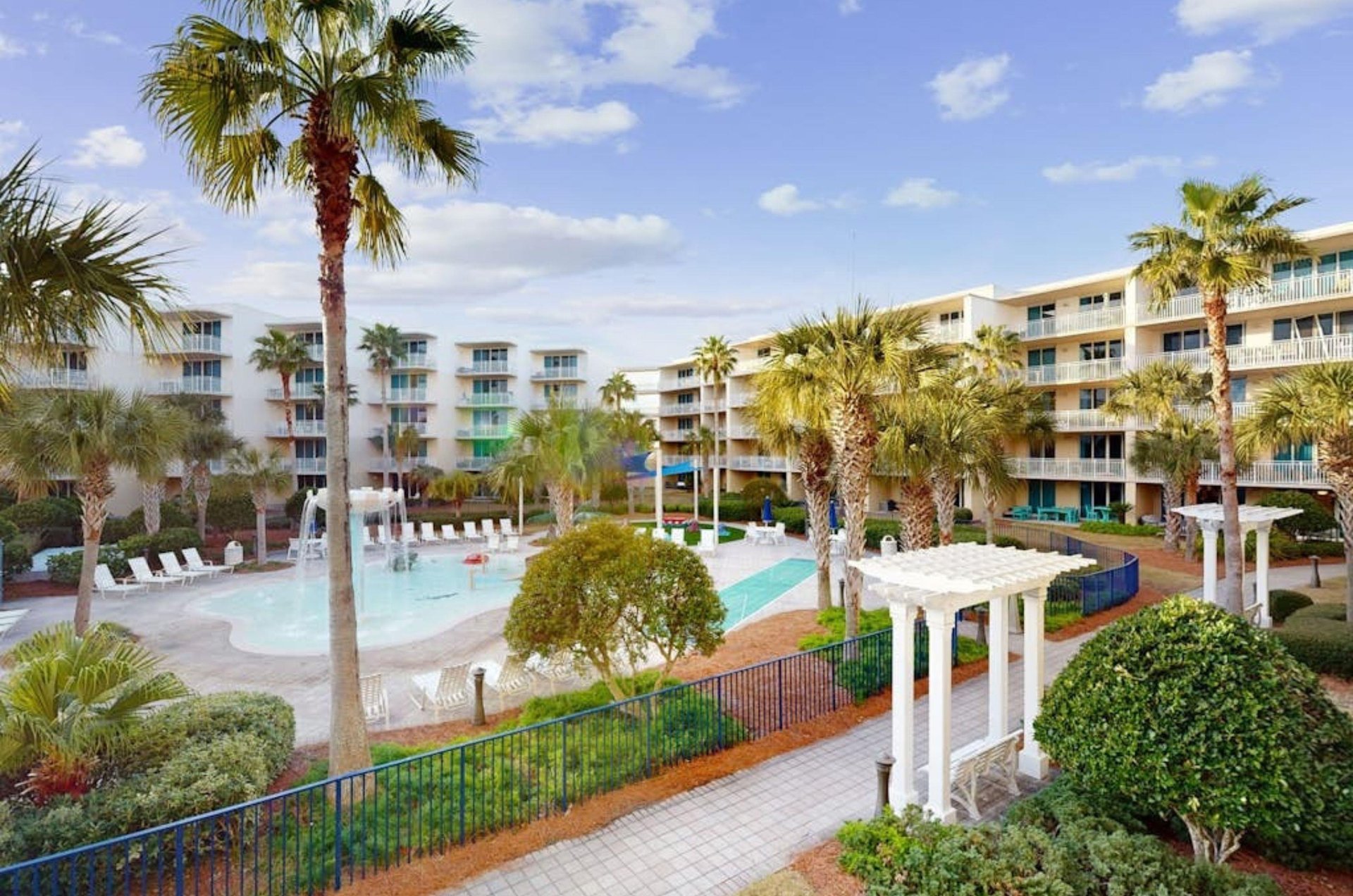 The luschious beachside courtyard boasts two outdoor hot tubs and a waterfall