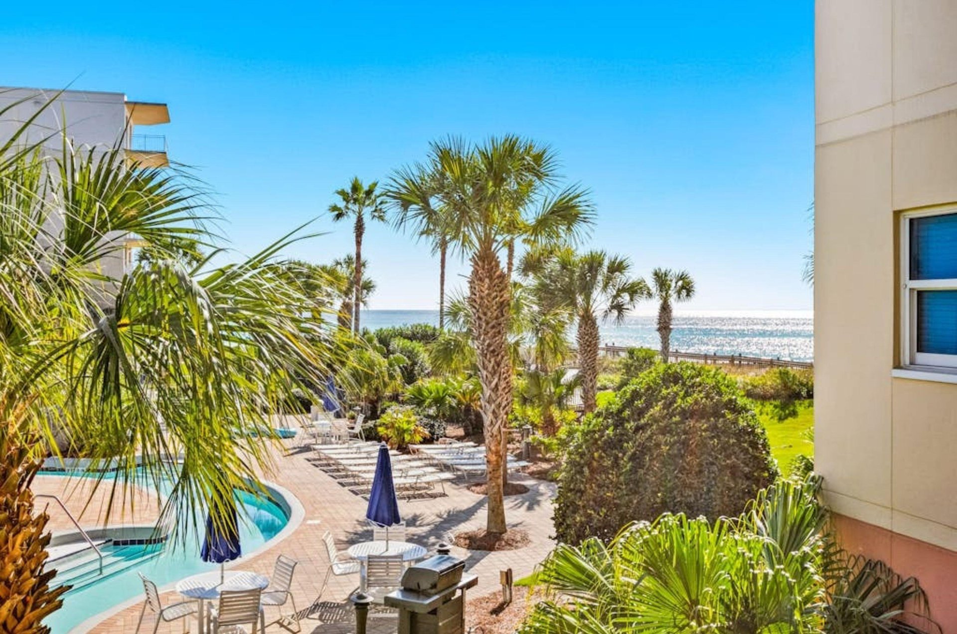 Lounge chairs on the beachside pool deck at Waterscape in Fort Walton Beach Florida