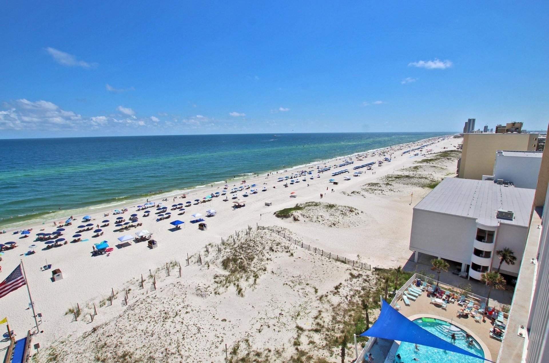 A view of the expansive beach from a balcony at San Carlos Gulf Shores
